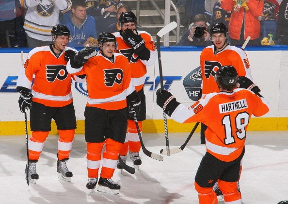 BUFFALO, NY - APRIL 08: Daniel Briere #48 (2nd from left) of the Philadelphia Flyers celebrates scoring Philadelphia's third goal against the Buffalo Sabres  at HSBC Arena on April 8, 2011 in Buffalo, New York.  (Photo by Rick Stewart/Getty Images)