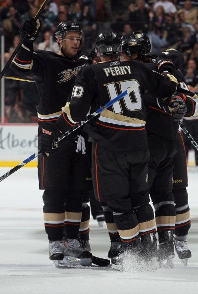 ANAHEIM, CA - APRIL 06:  Ryan Getzlaf (L) #15 and Corey Perry#10 of the Anaheim Ducks celebrate Cam Fowler's second period goal against the San Jose Sharks at Honda Center on April 6, 2011 in Anaheim, California.  (Photo by Jeff Gross/Getty Images)