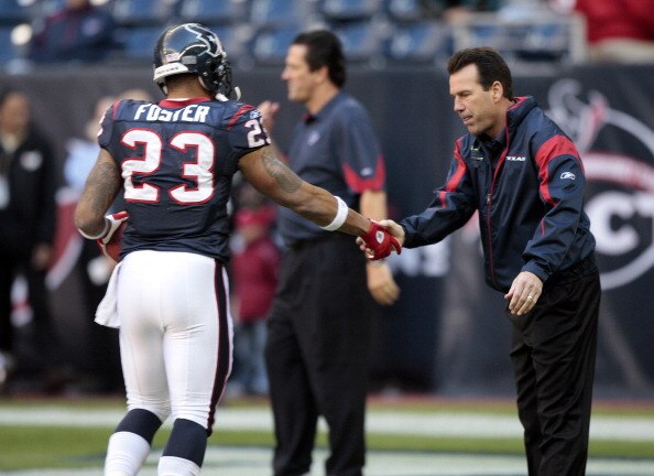 HOUSTON, TX - JANUARY 02:  Head coach Gary Kubiak of the Houston Texans greets running back Arian Foster #23 before playing the Jacksonville Jaguars at Reliant Stadium on January 2, 2011 in Houston, Texas.  (Photo by Bob Levey/Getty Images)