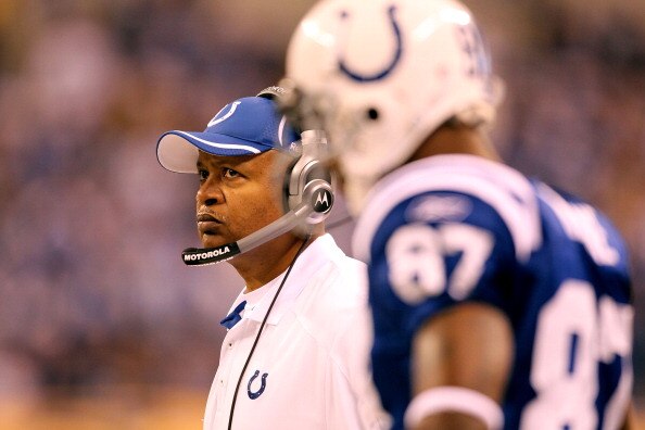INDIANAPOLIS, IN - JANUARY 08:  (L-R) Head coach Jim Caldwell and Reggie Wayne #87 of the Indianapolis Colts looks on against the New York Jets during their 2011 AFC wild card playoff game at Lucas Oil Stadium on January 8, 2011 in Indianapolis, Indiana.