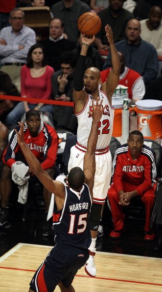 CHICAGO, IL - MARCH 11: Taj Gibson #22 of the Chicago Bulls puts up a shot over Al Horford #15 of the Atlanta Hawks at the United Center on March 11, 2011 in Chicago, Illinois. The Bulls defeated the Hawks 94-76. NOTE TO USER: User expressly acknowledges