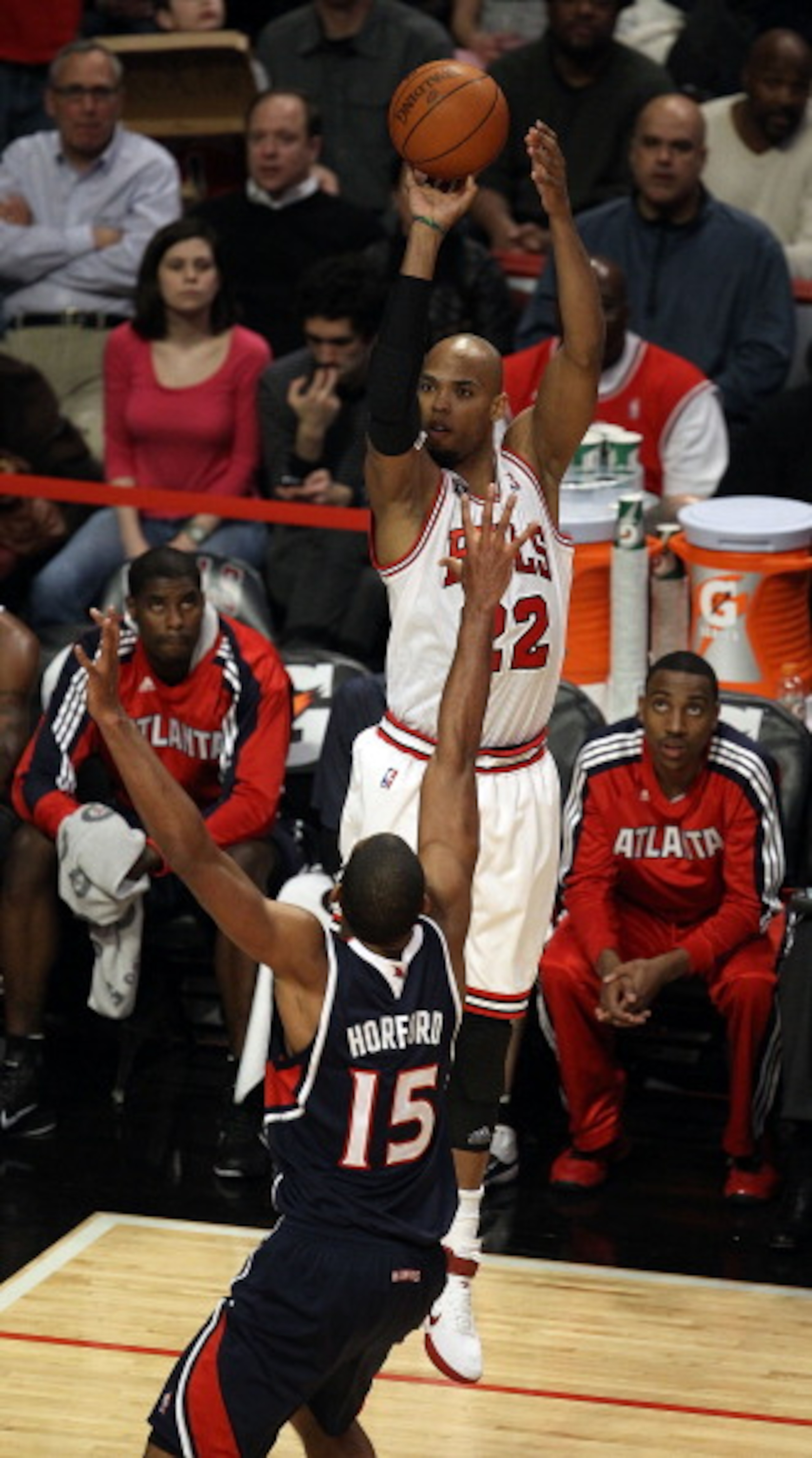 CHICAGO, IL - MARCH 11: Taj Gibson #22 of the Chicago Bulls puts up a shot over Al Horford #15 of the Atlanta Hawks at the United Center on March 11, 2011 in Chicago, Illinois. The Bulls defeated the Hawks 94-76. NOTE TO USER: User expressly acknowledges CHICAGO, IL - MARCH 11: Taj Gibson #22 of the Chicago Bulls puts up a shot over Al Horford #15 of the Atlanta Hawks at the United Center on March 11, 2011 in Chicago, Illinois. The Bulls defeated the Hawks 94-76. NOTE TO USER: User expressly acknowledges
