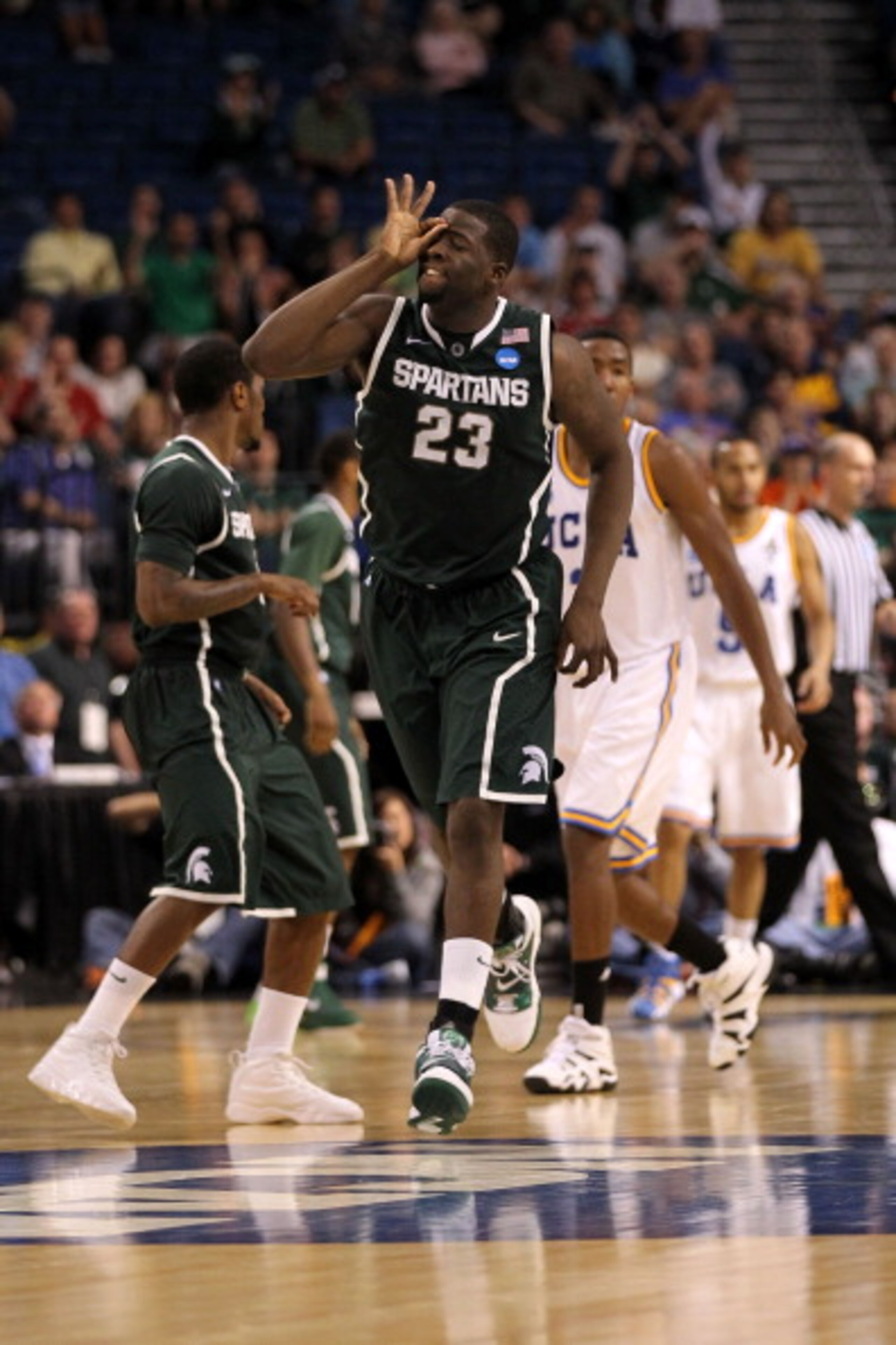 TAMPA, FL - MARCH 17: Draymond Green #23 of the Michigan State Spartans reacts after he made a 3-point shot in the second half against the UCLA Bruins during the second round of the 2011 NCAA men's basketball tournament at St. Pete Times Forum on March 1 TAMPA, FL - MARCH 17: Draymond Green #23 of the Michigan State Spartans reacts after he made a 3-point shot in the second half against the UCLA Bruins during the second round of the 2011 NCAA men's basketball tournament at St. Pete Times Forum on March 1