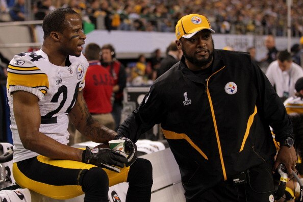 ARLINGTON, TX - FEBRUARY 06:  Ike Taylor #24 of the Pittsburgh Steelers talks with head coach Mike Tomlin of the Pittsburgh Steelers during Super Bowl XLV against the Green Bay Packers at Cowboys Stadium on February 6, 2011 in Arlington, Texas.  (Photo by