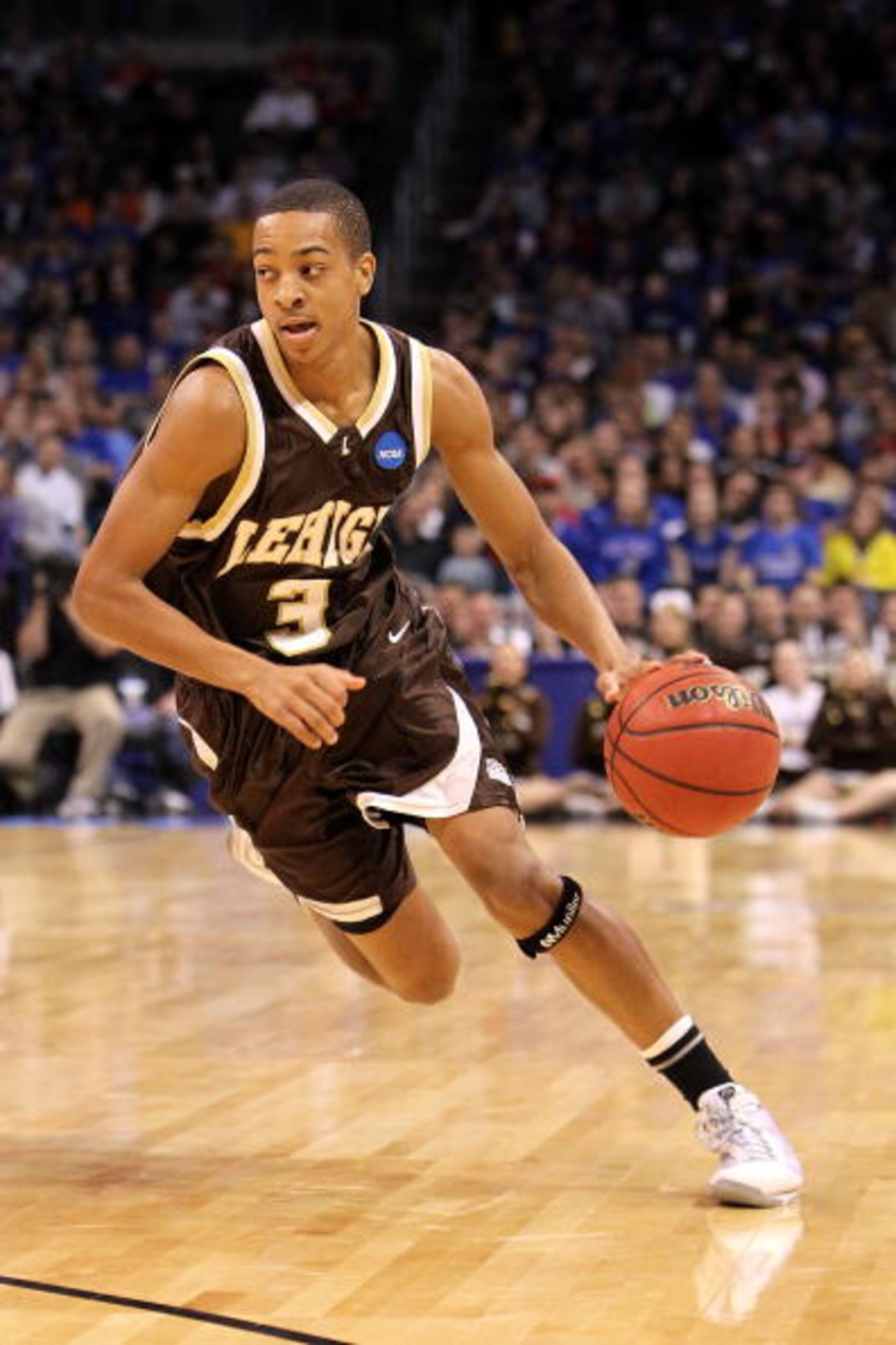 OKLAHOMA CITY - MARCH 18: CJ McCollum #3 of the Lehigh Mountain Hawks drives against the Kansas Jayhawks during the first round of the 2010 NCAA men's basketball tournament at Ford Center on March 18, 2010 in Oklahoma City, Oklahoma. (Photo by Ronald Ma OKLAHOMA CITY - MARCH 18: CJ McCollum #3 of the Lehigh Mountain Hawks drives against the Kansas Jayhawks during the first round of the 2010 NCAA men's basketball tournament at Ford Center on March 18, 2010 in Oklahoma City, Oklahoma. (Photo by Ronald Ma