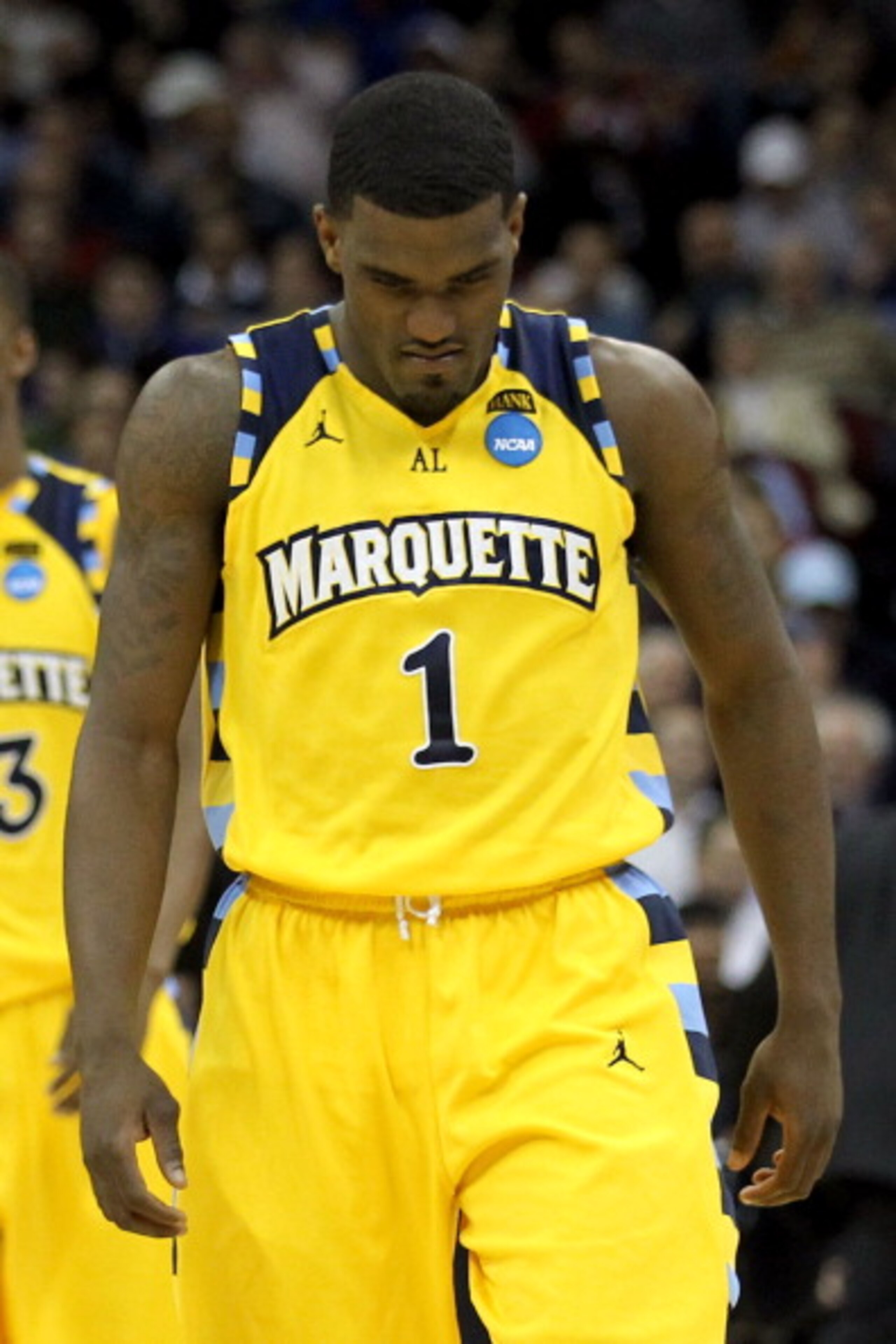 NEWARK, NJ - MARCH 25: Darius Johnson-Odom #1 of the Marquette Golden Eagles walks away after a play against the North Carolina Tar Heels during the first half of the east regional semifinal of the 2011 NCAA Men's Basketball Tournament at the Prudential NEWARK, NJ - MARCH 25: Darius Johnson-Odom #1 of the Marquette Golden Eagles walks away after a play against the North Carolina Tar Heels during the first half of the east regional semifinal of the 2011 NCAA Men's Basketball Tournament at the Prudential