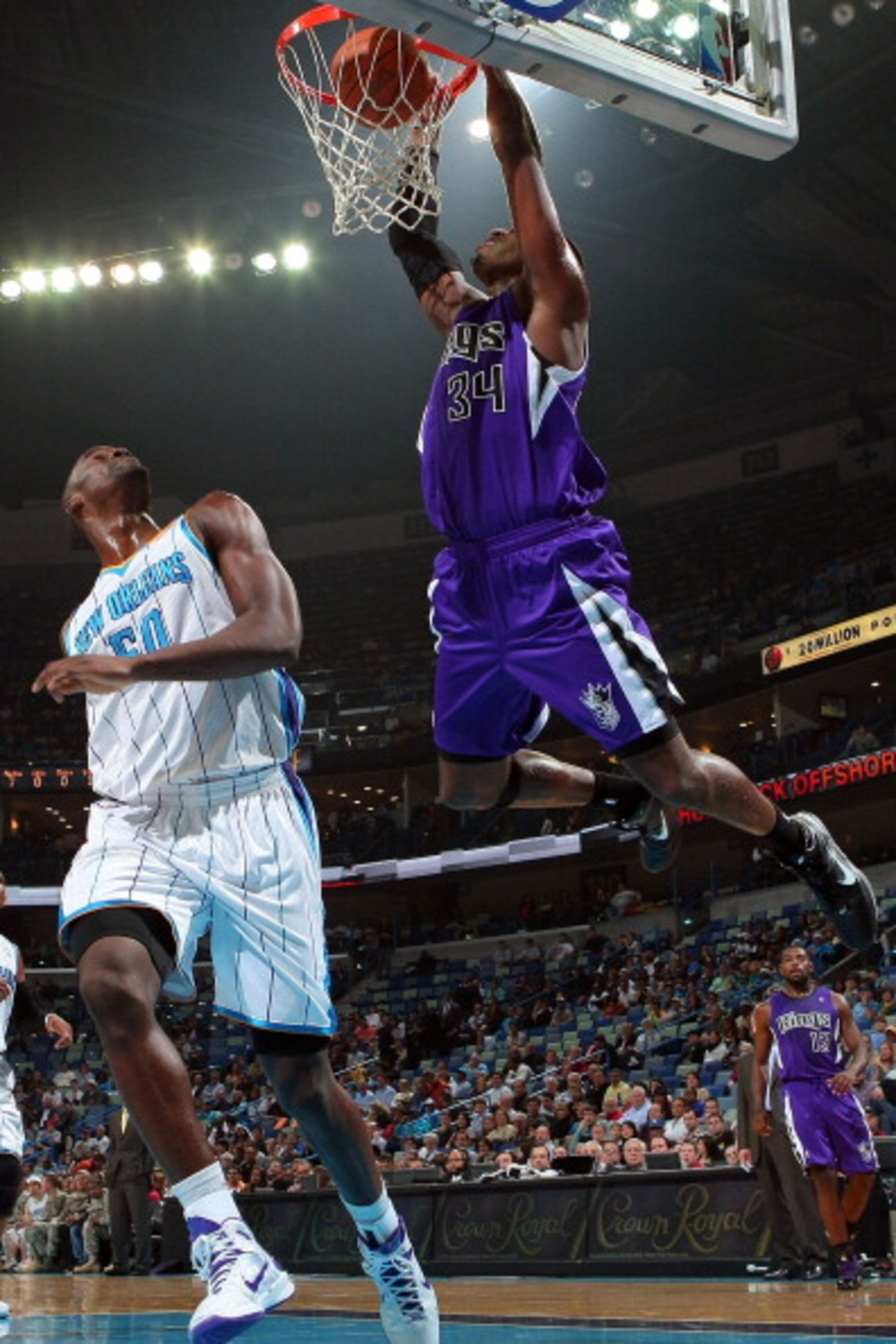 NEW ORLEANS, LA - DECEMBER 15: Jason Thompson #34 of the Sacramento Kings dunks the ball over Emeka Okafor #50 of the New Orleans Hornets at the New Orleans Arena on December 15, 2010 in New Orleans, Louisiana. NOTE TO USER: User expressly acknowledges NEW ORLEANS, LA - DECEMBER 15: Jason Thompson #34 of the Sacramento Kings dunks the ball over Emeka Okafor #50 of the New Orleans Hornets at the New Orleans Arena on December 15, 2010 in New Orleans, Louisiana. NOTE TO USER: User expressly acknowledges