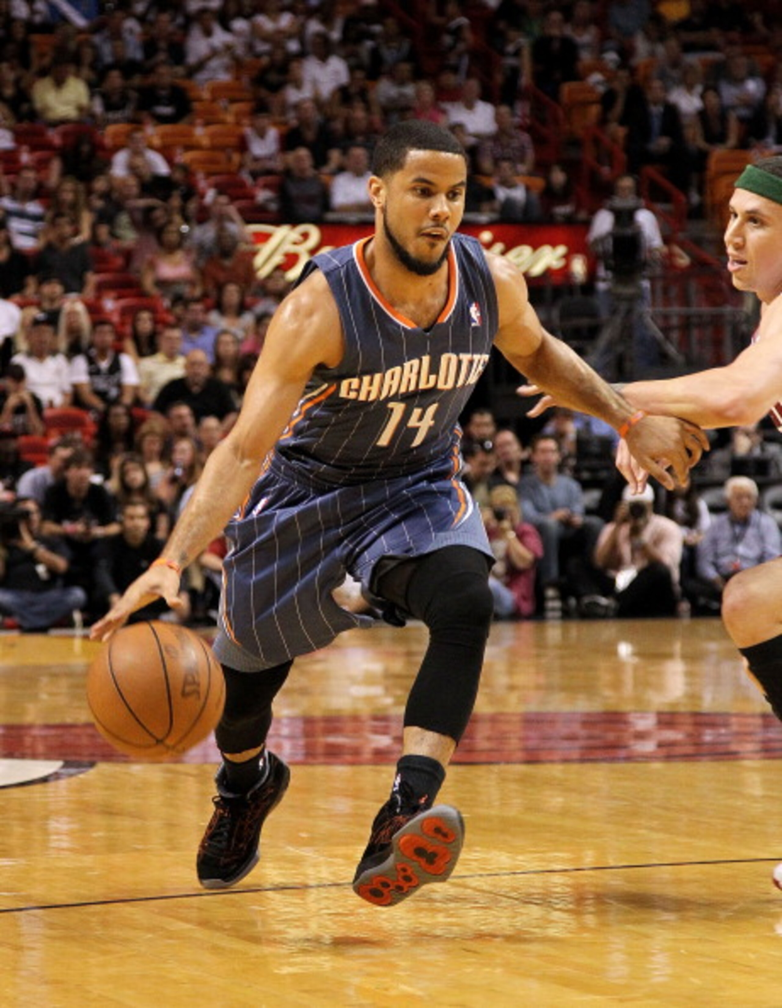 MIAMI, FL - APRIL 08: D.J. Augustin #14 of the Charlotte Bobcats drives to the lane during a game against the Miami Heat at American Airlines Arena on April 8, 2011 in Miami, Florida. NOTE TO USER: User expressly acknowledges and agrees that, by download MIAMI, FL - APRIL 08: D.J. Augustin #14 of the Charlotte Bobcats drives to the lane during a game against the Miami Heat at American Airlines Arena on April 8, 2011 in Miami, Florida. NOTE TO USER: User expressly acknowledges and agrees that, by download