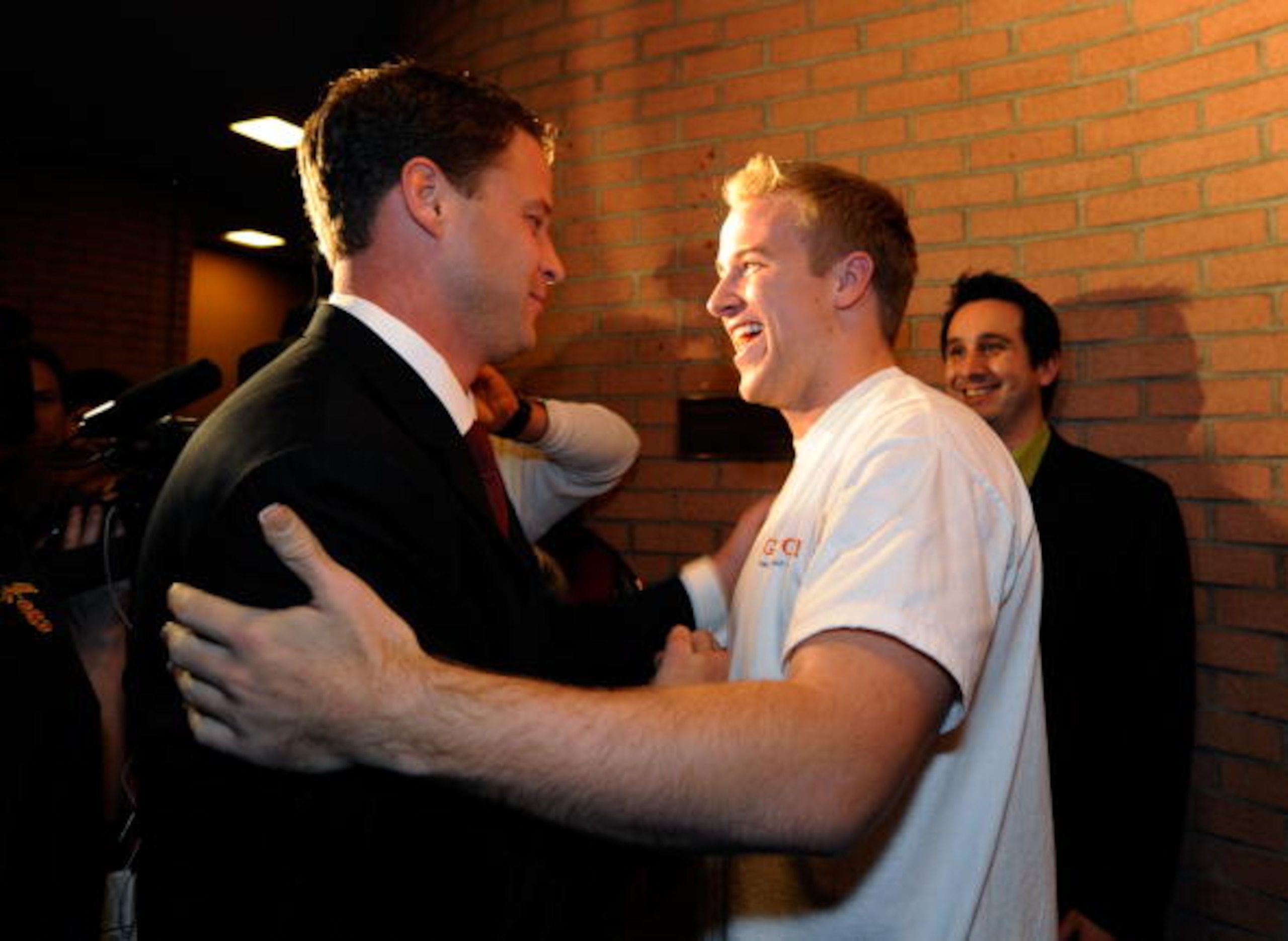 LOS ANGELES, CA - JANUARY 13:  Lane Kiffin (L) new college football coach of University of Southern California greets quarterback Matt Barkley after arriving for a news conference at Heritage Hall on the campus of USC on January 13, 2010 in Los Angeles, C