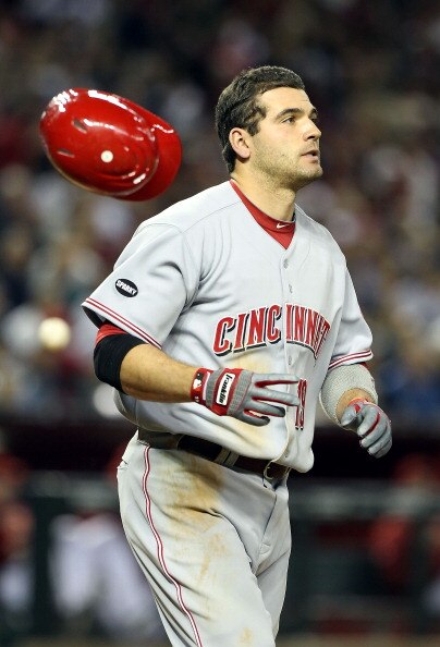 PHOENIX, AZ - APRIL 08:  Joey Votto #19 of the Cincinnati Reds flips his helmet after striking out against the Arizona Diamondbacks during the sixth inning of the Major League Baseball home opening game at Chase Field on April 8, 2011 in Phoenix, Arizona.