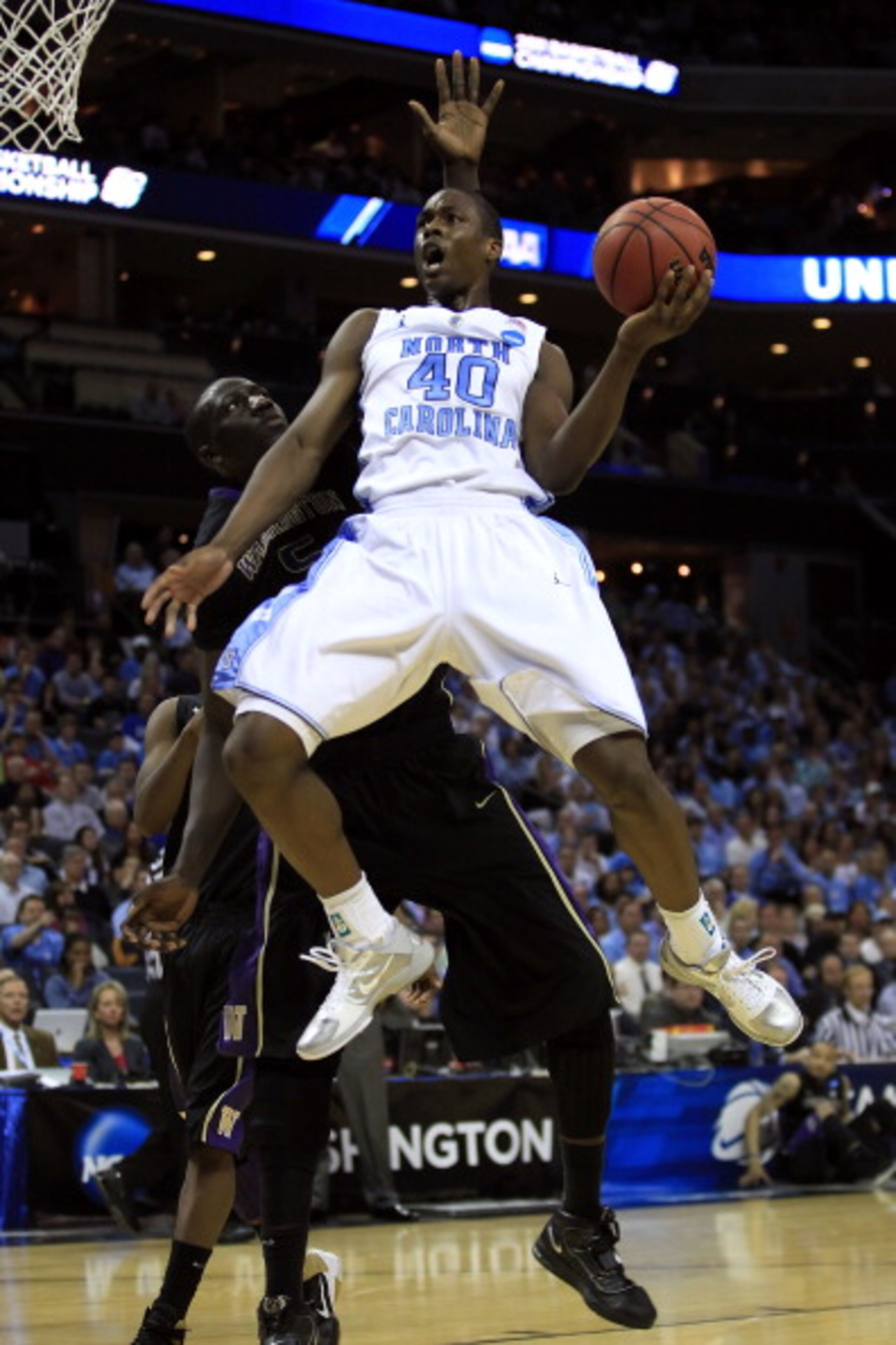 CHARLOTTE, NC - MARCH 20:  Harrison Barnes #40 of the North Carolina Tar Heels goes up for a shot against Aziz N'Diaye #5 of the Washington Huskies in the first half during the third round of the 2011 NCAA men's basketball tournament at Time Warner Cable 
