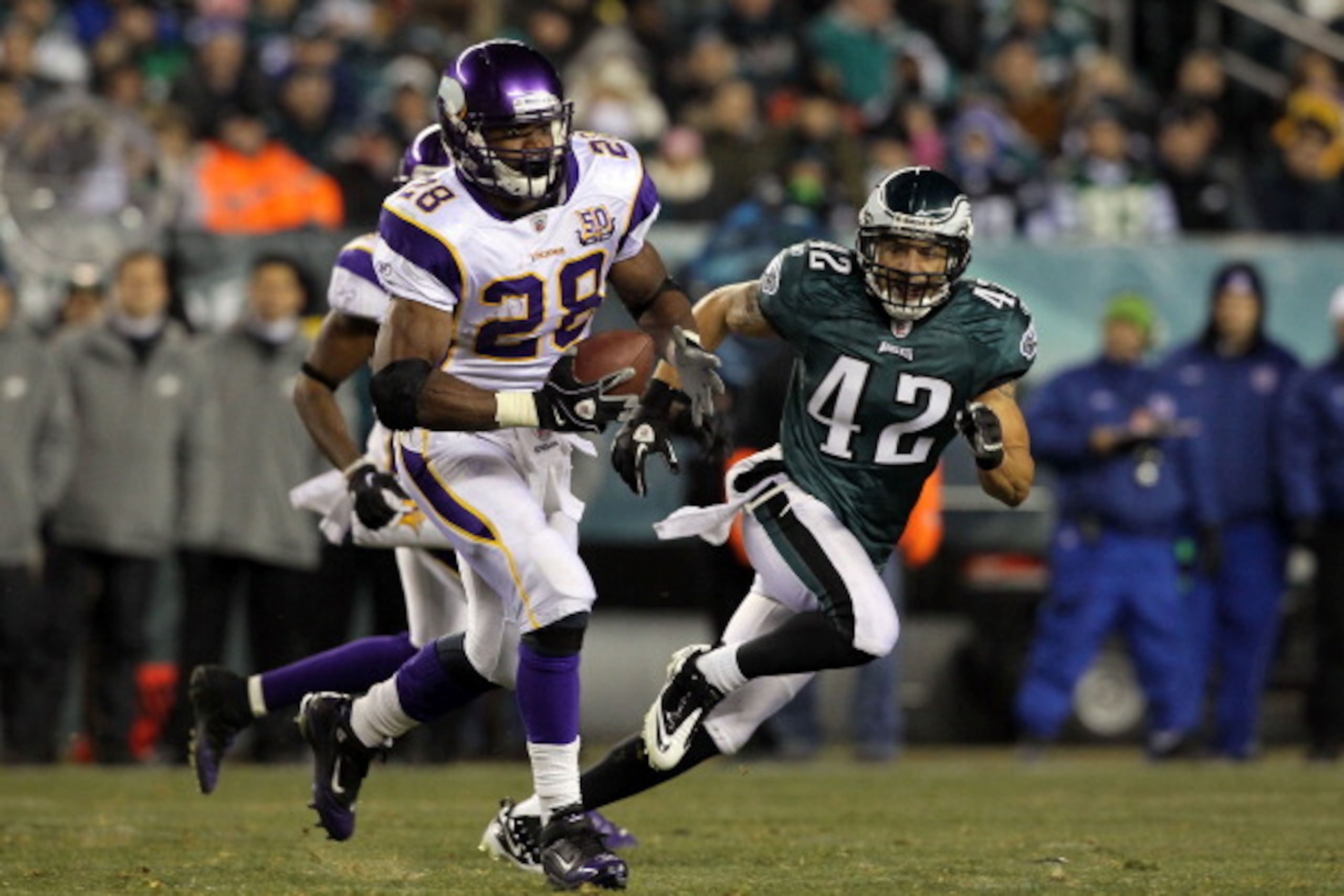 PHILADELPHIA, PA - DECEMBER 28: Adrian Peterson #28 of the Minnesota Vikings runs against Kurt Coleman #42 of the Philadelphia Eagles at Lincoln Financial Field on December 28, 2010 in Philadelphia, Pennsylvania. (Photo by Jim McIsaac/Getty Images)