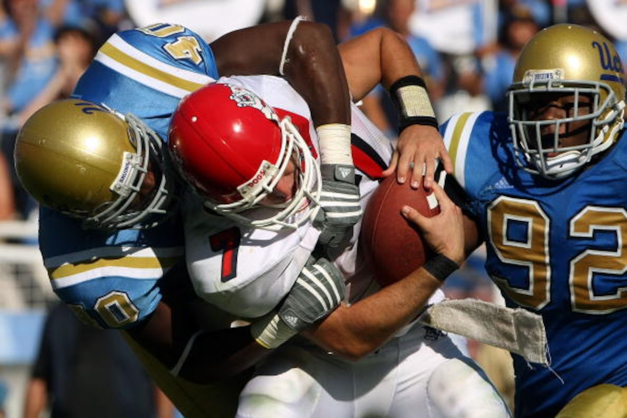 PASADENA, CA - SEPTEMBER 27:  Quarterback Tom Brandstater #7 of the Frenso State Bulldogs is sacked by Akeem Ayers #40 of the UCLA Bruins during the game on September 27, 2008 at the Rose Bowl in Pasadena, California.  Fresno State defeated UCLA 36-31.  (