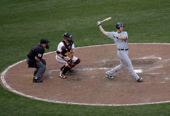 BALTIMORE, MD - APRIL 04:  Batter Brennan Boesch #26 of the Detroit Tigers strikes out swinging to end the eighth inning as umpire Derryl Cousins #13 and catcher Matt Wieters #32 of the Baltimore Orioles look on during opening day at Oriole Park at Camden