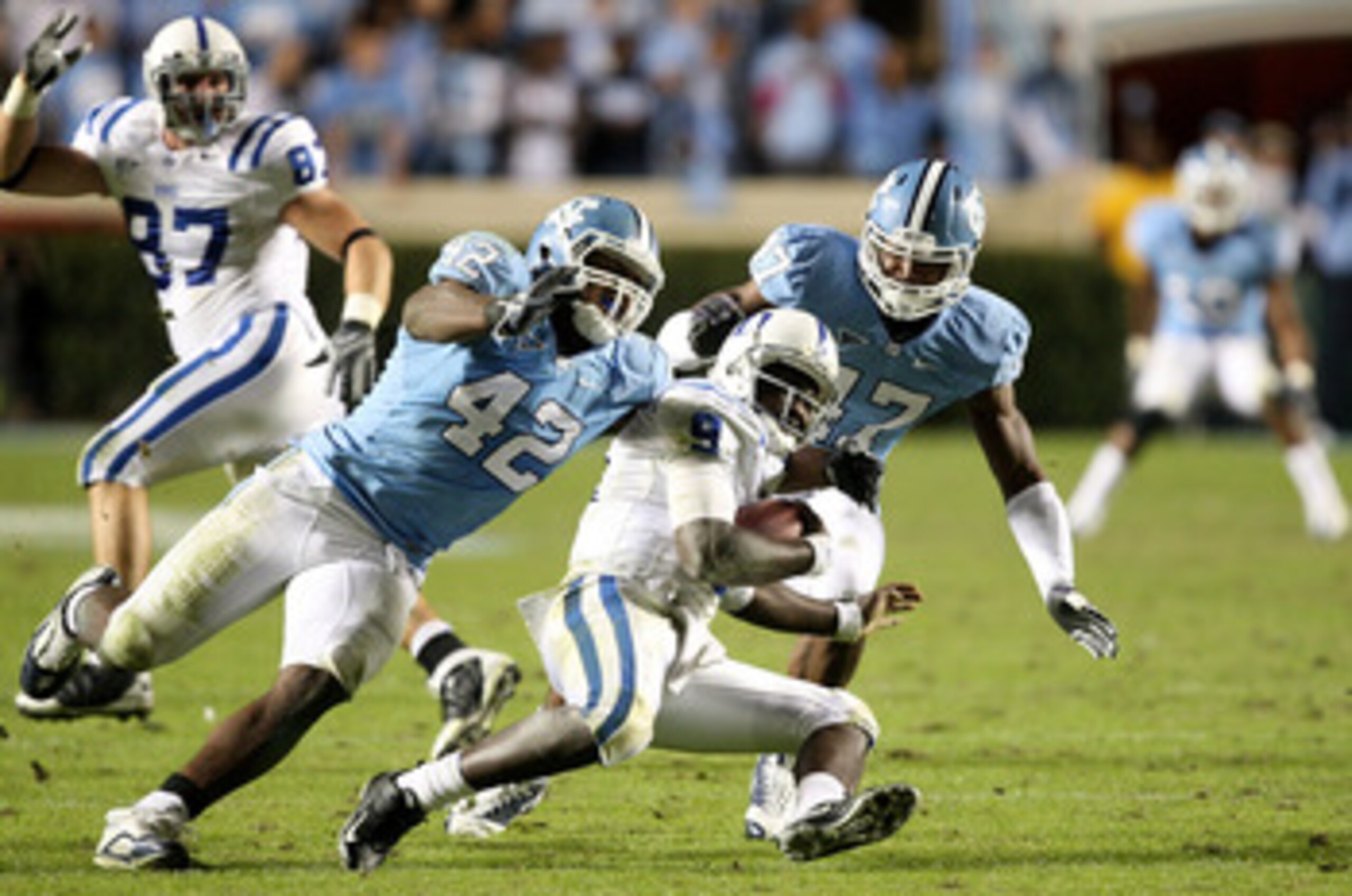 CHAPEL HILL, NC - NOVEMBER 07: Thaddeus Lewis #9 of the Duke Blue Devils is sacked by Robert Quinn #42 of the North Carolina Tar Heels during their game at Kenan Stadium on November 7, 2009 in Chapel Hill, North Carolina. (Photo by Streeter Lecka/Getty CHAPEL HILL, NC - NOVEMBER 07: Thaddeus Lewis #9 of the Duke Blue Devils is sacked by Robert Quinn #42 of the North Carolina Tar Heels during their game at Kenan Stadium on November 7, 2009 in Chapel Hill, North Carolina. (Photo by Streeter Lecka/Getty