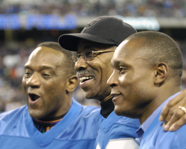 Detroit Lions running backs Billy Simms and Barry Sanders flank Lem Barney before play against  the Indianapolis Colts in a Thanksgiving Day game, November 25, 2005 in Detroit.  The Colts defeated the Lions 41 to 9.  (Photo by Al Messerschmidt/Getty Image