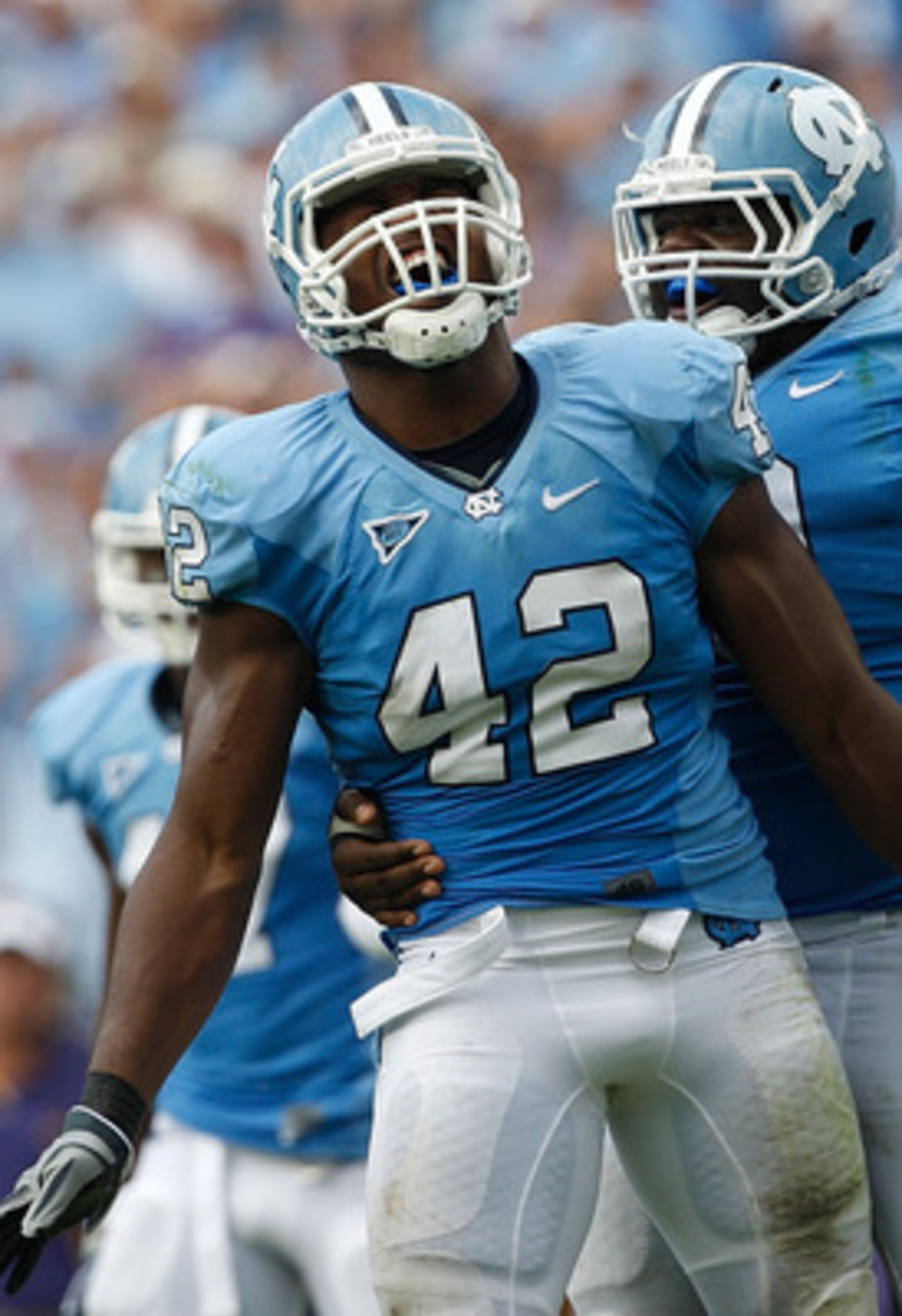 CHAPEL HILL, NC - SEPTEMBER 19: Robert Quinn #42 of the North Carolina Tar Heels celebrates after a sack with teammate Marvin Austin #9 against the East Carolina Pirates at Kenan Stadium on September 19, 2009 in Chapel Hill, North Carolina. (Photo by St CHAPEL HILL, NC - SEPTEMBER 19: Robert Quinn #42 of the North Carolina Tar Heels celebrates after a sack with teammate Marvin Austin #9 against the East Carolina Pirates at Kenan Stadium on September 19, 2009 in Chapel Hill, North Carolina. (Photo by St