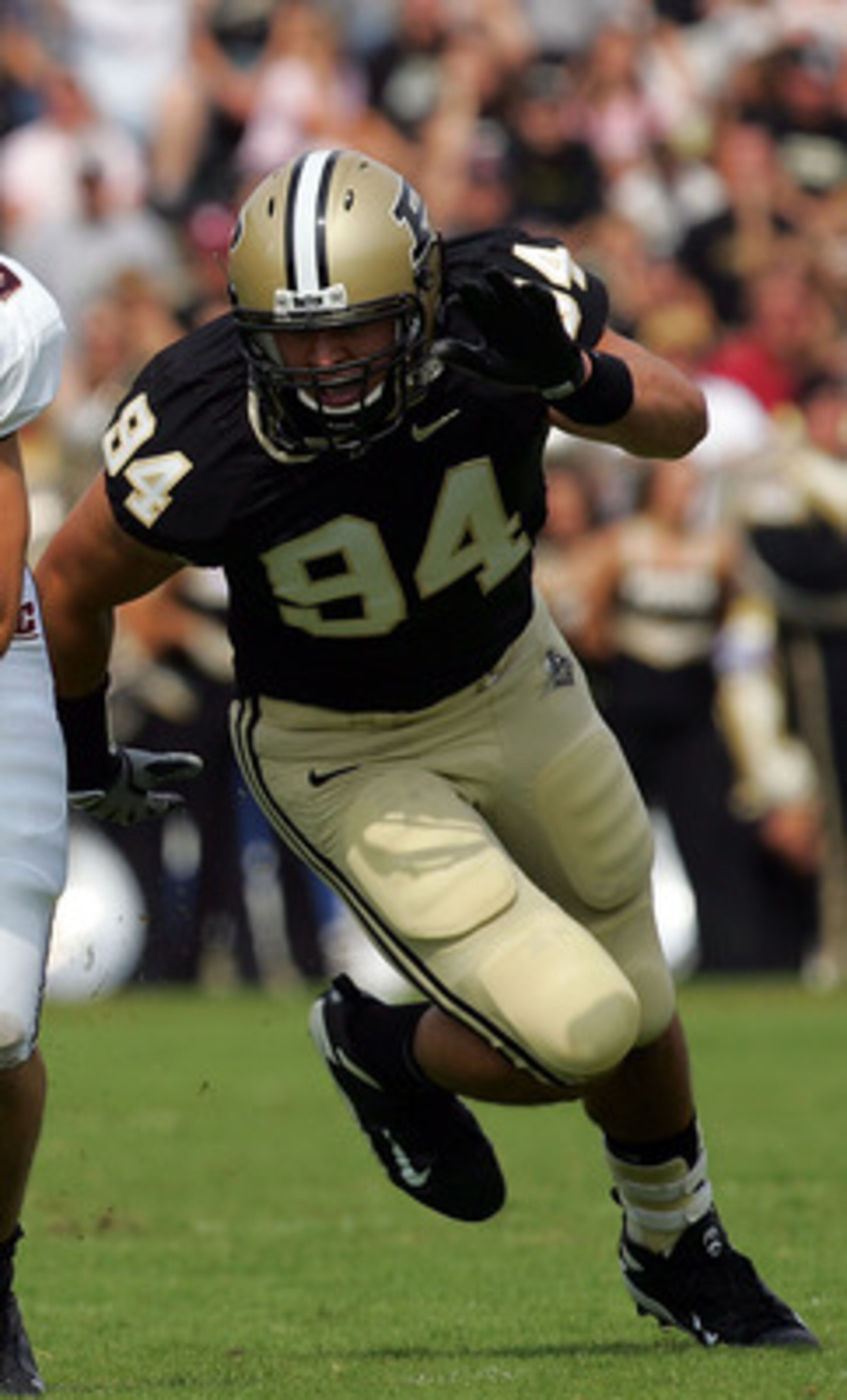 WEST LAFAYETTE, IN - SEPTEMBER 20: Quarterback Dan LeFevour #13 of the Central Michigan Chippewas runs the ball past Ryan Kerrigan #94 of the Purdue Boilermakers at Ross-Ade Stadium on September 20, 2008 in West Lafayette, Indiana. (Photo by Ronald Mart WEST LAFAYETTE, IN - SEPTEMBER 20: Quarterback Dan LeFevour #13 of the Central Michigan Chippewas runs the ball past Ryan Kerrigan #94 of the Purdue Boilermakers at Ross-Ade Stadium on September 20, 2008 in West Lafayette, Indiana. (Photo by Ronald Mart