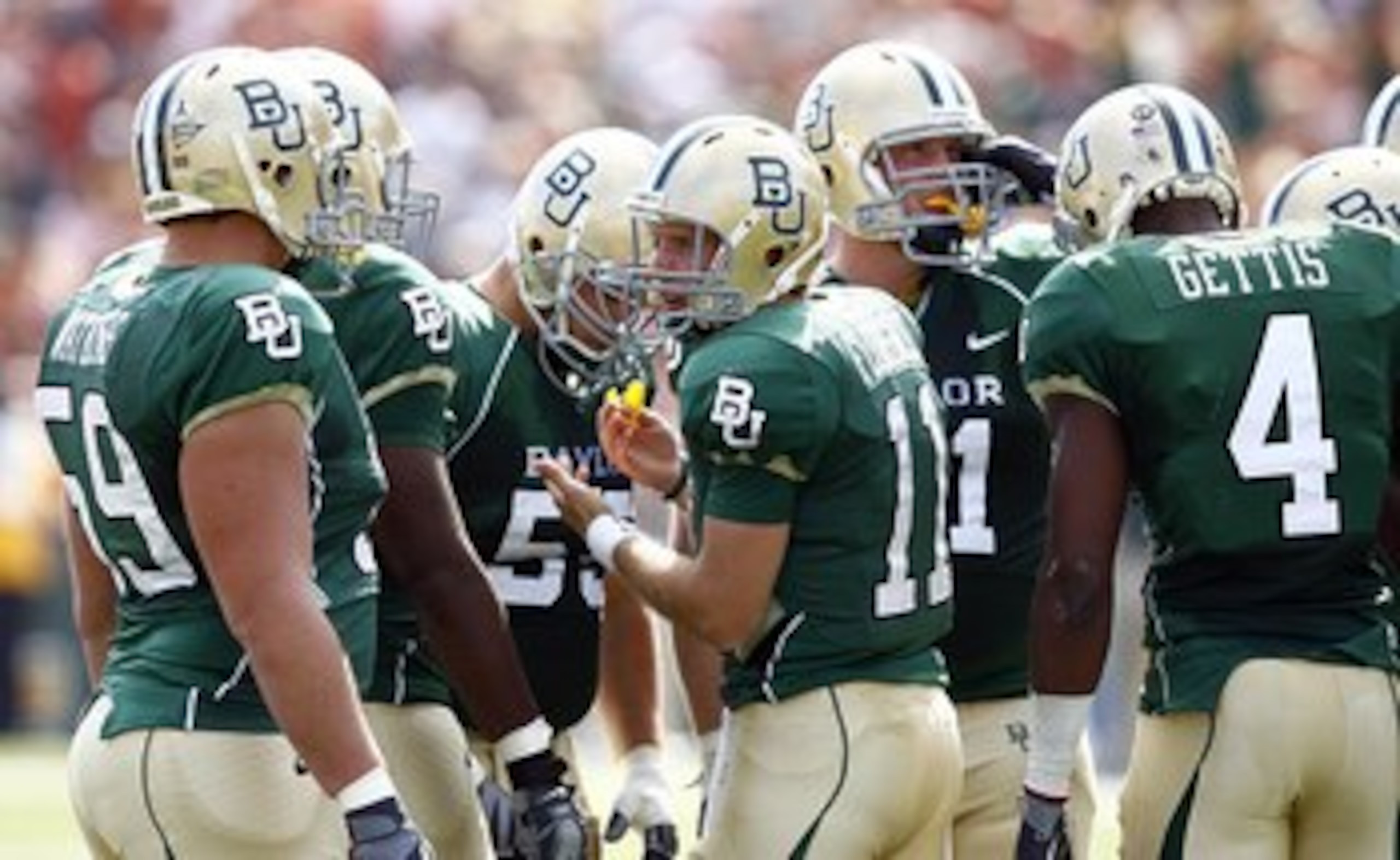 WACO, TX - NOVEMBER 14:  Quarterback Nick Florence #11 of the Baylor Bears leads his team in the huddle against the Texas Longhorns in the second half on November 14, 2009 at Floyd Casey Stadium in Waco, Texas. (Photo by Tom Pennington/Getty Images)