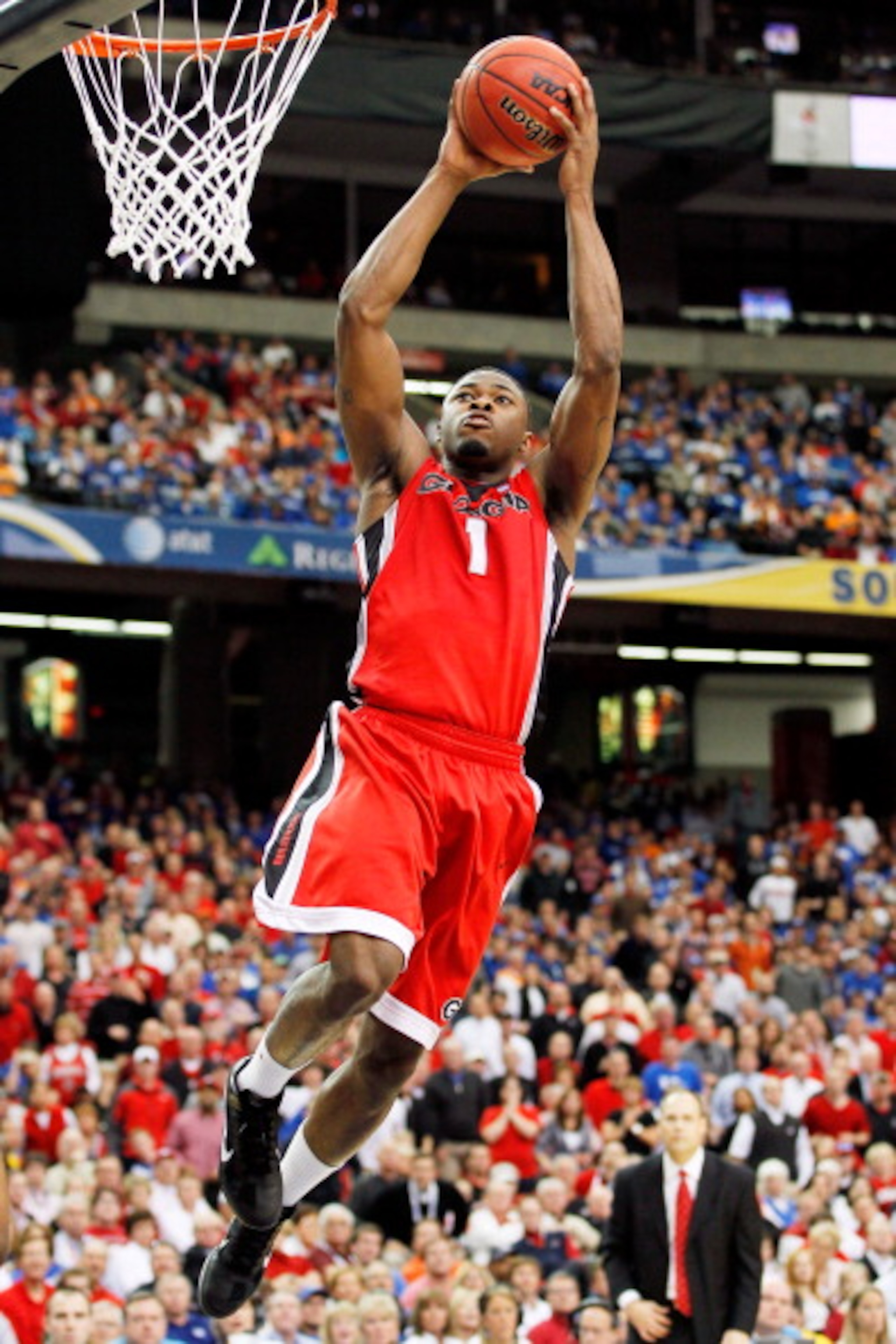 ATLANTA, GA - MARCH 11: Travis Leslie #1 of the Georgia Bulldogs dunks on the Alabama Crimson Tide during the quarterfinals of the SEC Men's Basketball Tournament at Georgia Dome on March 11, 2011 in Atlanta, Georgia. (Photo by Kevin C. Cox/Getty Images ATLANTA, GA - MARCH 11: Travis Leslie #1 of the Georgia Bulldogs dunks on the Alabama Crimson Tide during the quarterfinals of the SEC Men's Basketball Tournament at Georgia Dome on March 11, 2011 in Atlanta, Georgia. (Photo by Kevin C. Cox/Getty Images