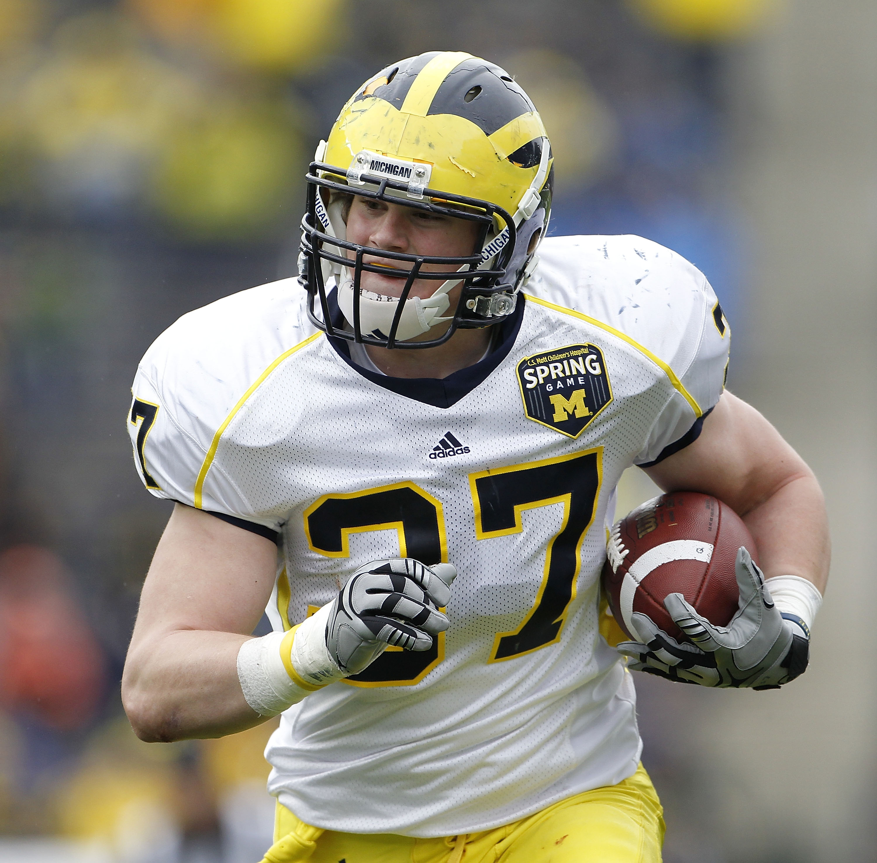 ANN ARBOR, MI - APRIL 16: Jake Ryan #37 of the Michigan Wolverines scores after an interception during the annual Spring Game at Michigan Stadium on April 16, 2011 in Ann Arbor, Michigan.  (Photo by Leon Halip/Getty Images)