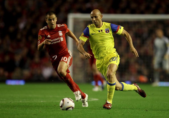LIVERPOOL, ENGLAND - SEPTEMBER 16 :  Joe Cole of Liverpool competes with Stanislav Angelov of Steaua Bucharest during the UEFA Europa League Group K match beteween Liverpool and Steaua Bucharest at Anfield on September 16, 2010 in Liverpool, England.  (Ph