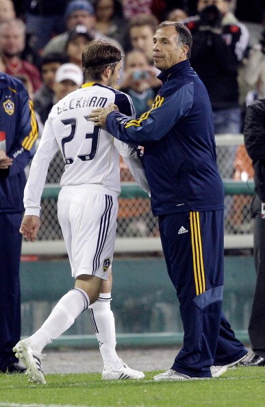 WASHINGTON, DC - APRIL 09:  David Beckham #23 of the Los Angeles Galaxy is patted on the back by head coach Bruce Arena against the D.C. United during the second half at RFK Stadium on April 9, 2011 in Washington, DC. The game ended in a 1-1  draw. (Photo
