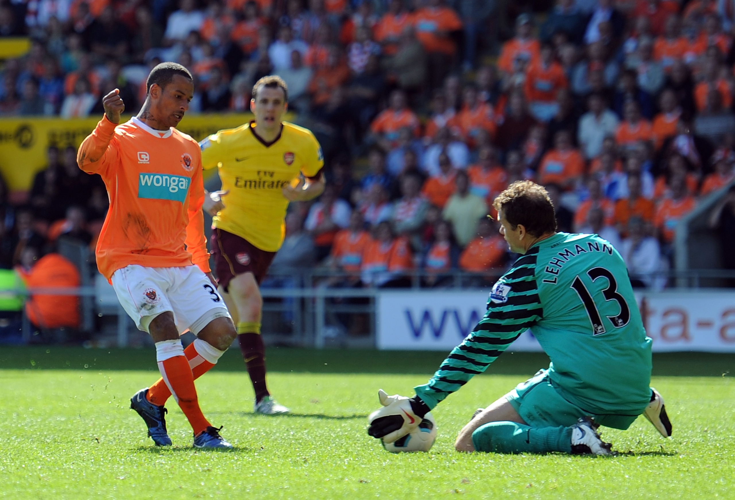 BLACKPOOL, ENGLAND - APRIL 10: Jens Lehmann of Arsenal saves the shot of DJ Campbell of Blackpool during the Barclays Premier League match between Blackpool and Arsenal at Bloomfield Road on April 10, 2011 in Blackpool, England. (Photo by Chris Brunskil BLACKPOOL, ENGLAND - APRIL 10: Jens Lehmann of Arsenal saves the shot of DJ Campbell of Blackpool during the Barclays Premier League match between Blackpool and Arsenal at Bloomfield Road on April 10, 2011 in Blackpool, England. (Photo by Chris Brunskil
