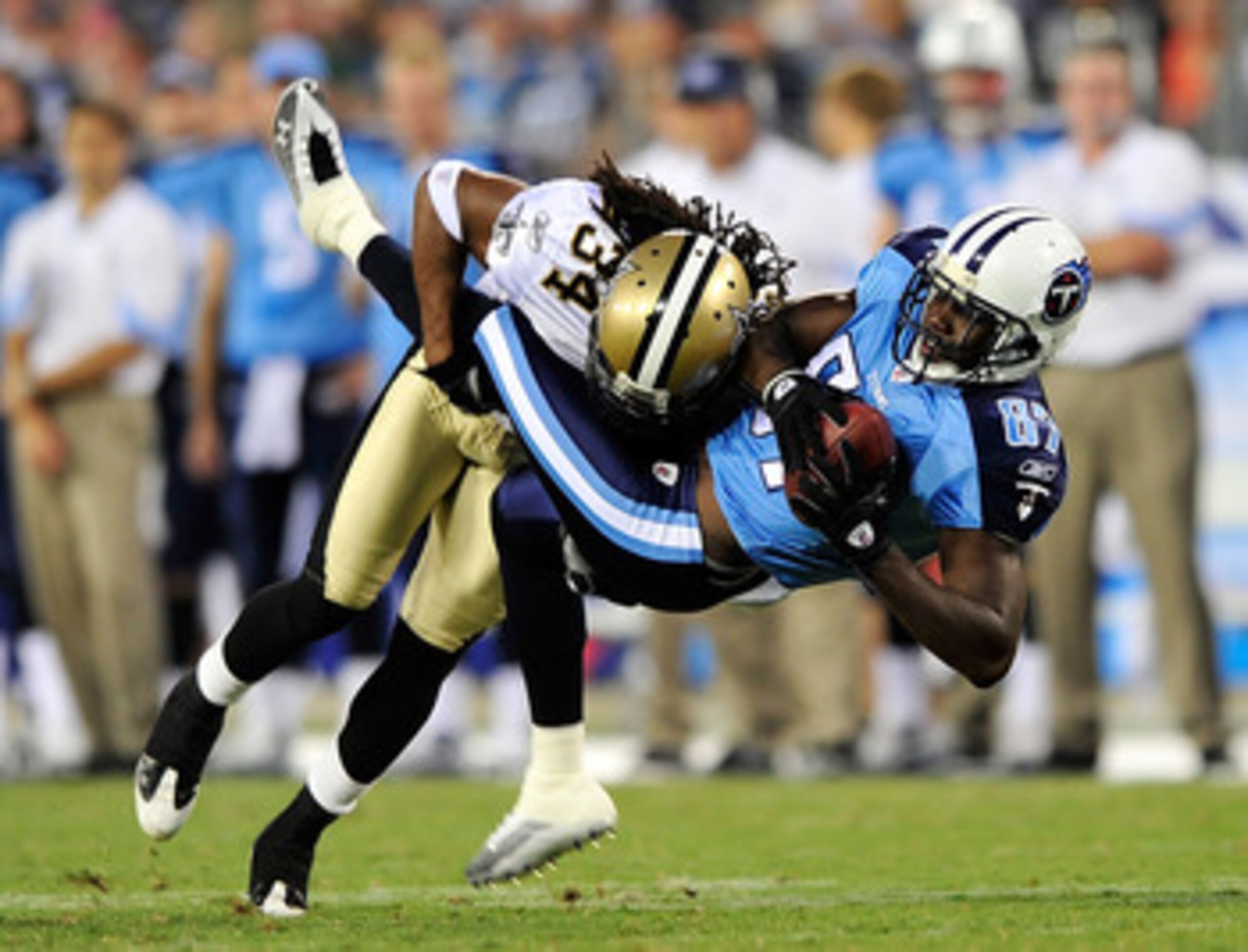 NASHVILLE, TN - SEPTEMBER 02:  Patrick Robinson #34 of the New Orleans Saints makes the hit on Lavelle Hawkins #87 of the Tennessee Titans after a 5-yard gain during the first half of an exhibition game at LP Field on September 2, 2010 in Nashville, Tenne