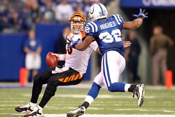 INDIANAPOLIS - NOVEMBER 14: Carson Palmer #9 of the Cincinnati Bengals tries to avoid Jerry Hughes #92 of the Indianapolis Colts during the NFL game at Lucas Oil Stadium on November 14, 2010 in Indianapolis, Indiana. The Colts won 23-17. (Photo by Andy INDIANAPOLIS - NOVEMBER 14: Carson Palmer #9 of the Cincinnati Bengals tries to avoid Jerry Hughes #92 of the Indianapolis Colts during the NFL game at Lucas Oil Stadium on November 14, 2010 in Indianapolis, Indiana. The Colts won 23-17. (Photo by Andy