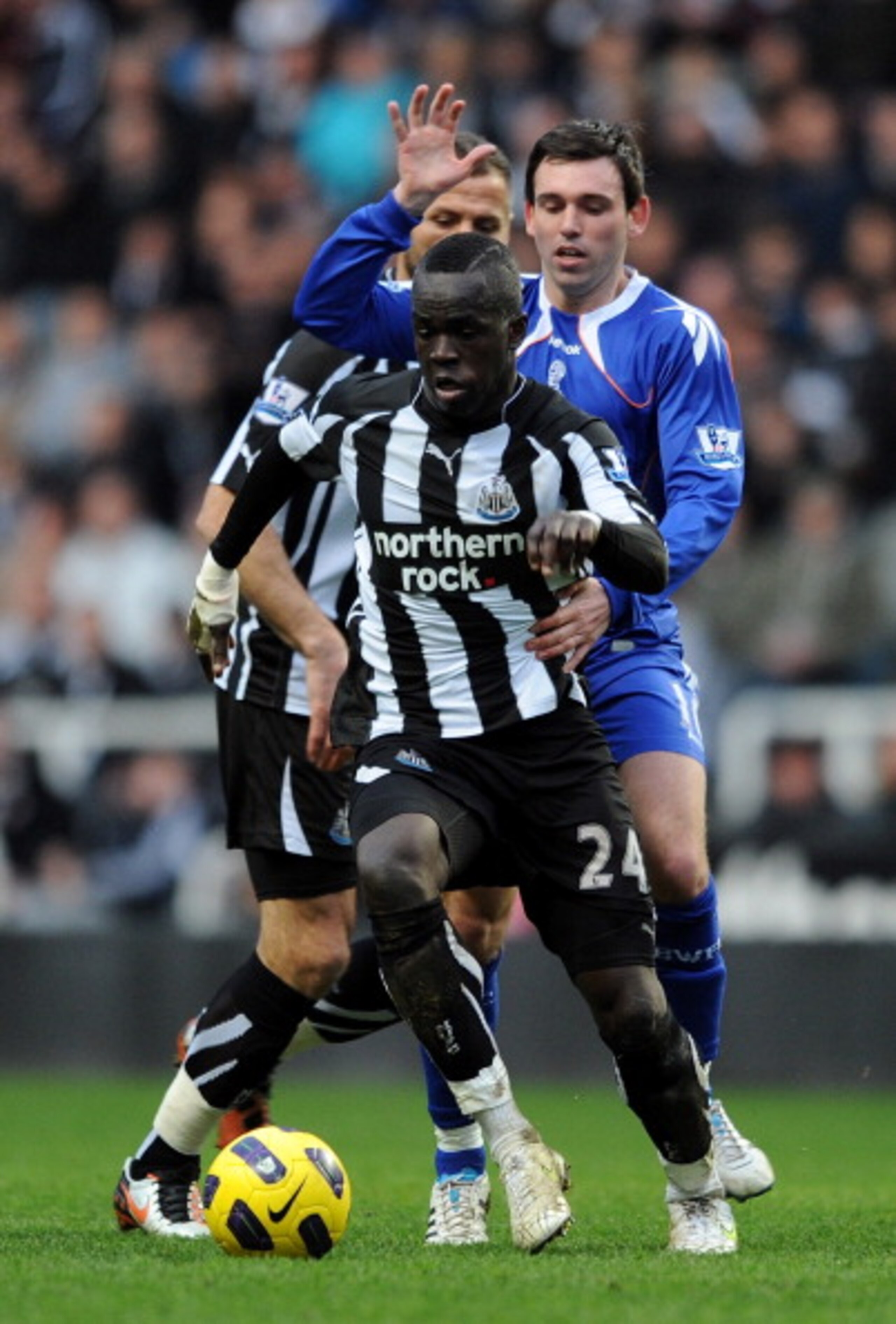 NEWCASTLE UPON TYNE, ENGLAND - FEBRUARY 26: Cheik Tiote of Newcastle United competes with Mark Davies of Bolton Wanderers during the Barclays Premier League match between Newcastle United and Bolton Wanderers at St James' Park on February 26, 2011 in Newc NEWCASTLE UPON TYNE, ENGLAND - FEBRUARY 26: Cheik Tiote of Newcastle United competes with Mark Davies of Bolton Wanderers during the Barclays Premier League match between Newcastle United and Bolton Wanderers at St James' Park on February 26, 2011 in Newc