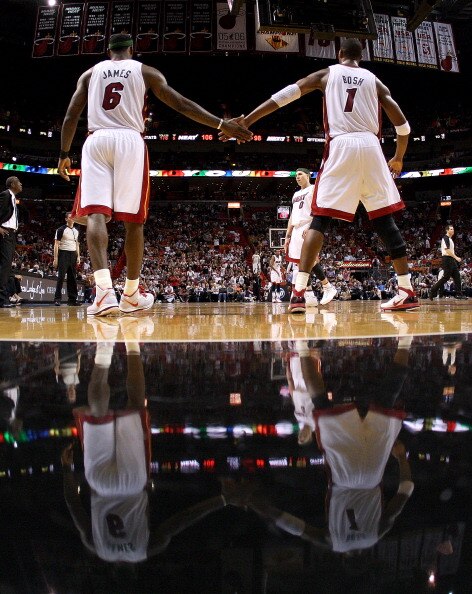 MIAMI, FL - APRIL 08: LeBron James #6 of the Miami Heat is congratulated by Chris Bosh #1 during a game against the Charlotte Bobcats at American Airlines Arena on April 8, 2011 in Miami, Florida. NOTE TO USER: User expressly acknowledges and agrees that,