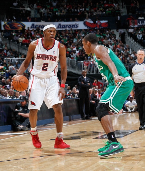 ATLANTA, GA - APRIL 01:  Joe Johnson #2 of the Atlanta Hawks against Rajon Rondo #9 of the Boston Celtics at Philips Arena on April 1, 2011 in Atlanta, Georgia.  NOTE TO USER: User expressly acknowledges and agrees that, by downloading and/or using this P