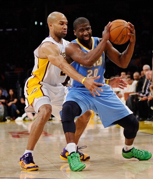 LOS ANGELES, CA - APRIL 03:  Raymond Felton #20 of the Denver Nuggets is pressured by Derek Fisher #2 of the Los Angeles Lakers at Staples Center on April 3, 2011 in Los Angeles, California. NOTE TO USER: User expressly acknowledges and agrees that, by do