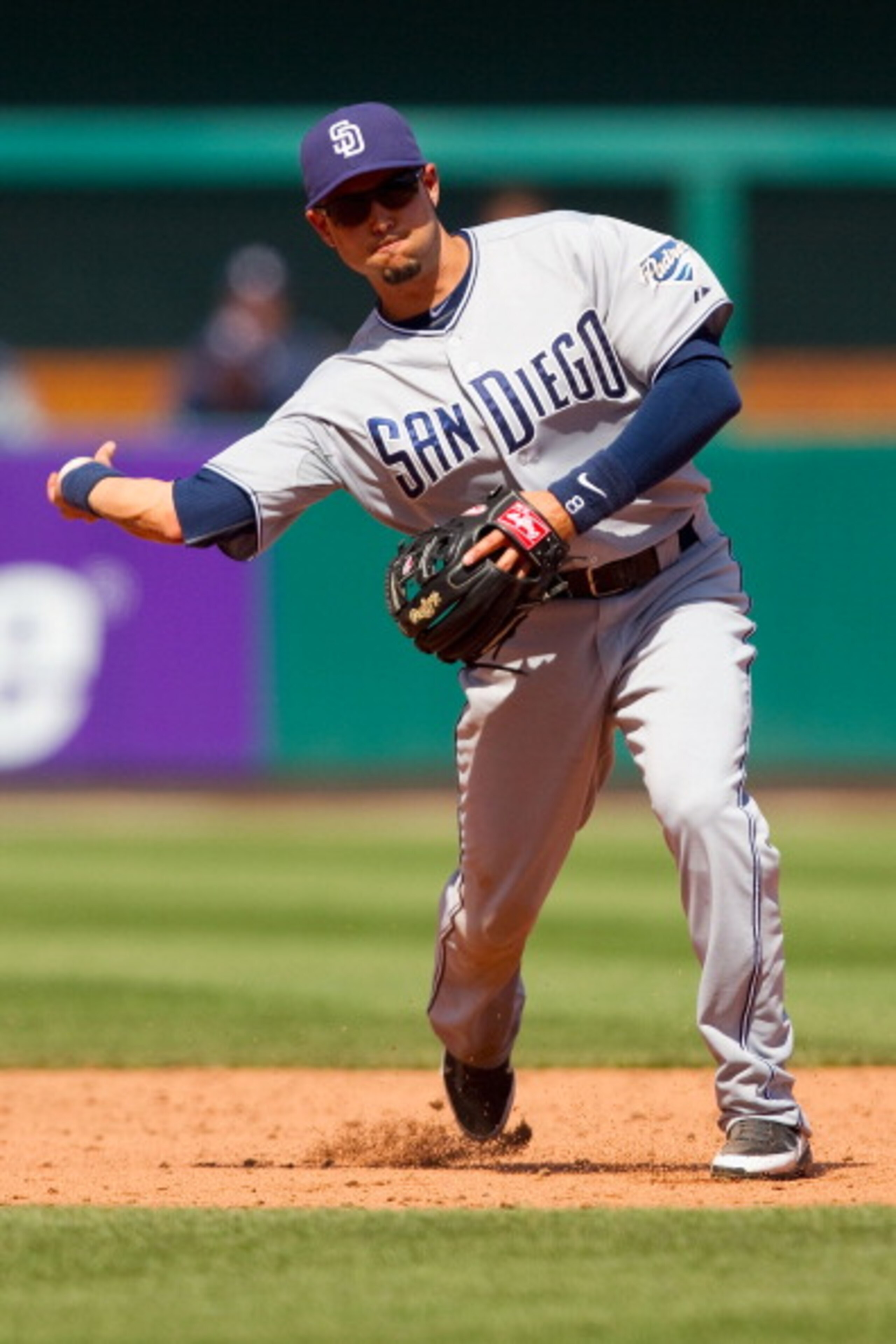 ST. LOUIS, MO - APRIL 3: Jason Bartlett #8 of the San Diego Padres throws to first base against the St. Louis Cardinals at Busch Stadium on April 3, 2011 in St. Louis, Missouri.  (Photo by Dilip Vishwanat/Getty Images)