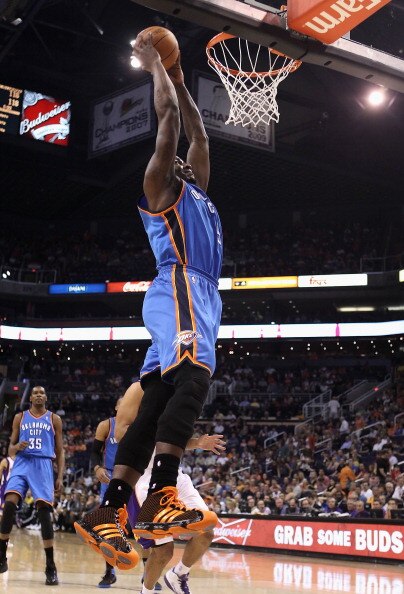 PHOENIX, AZ - MARCH 30:  Kendrick Perkins #5 of the Oklahoma City Thunder slam dunks during the NBA game against the Phoenix Suns at US Airways Center on March 30, 2011 in Phoenix, Arizona. The Thunder defeated the Suns 116-98.   NOTE TO USER: User expres