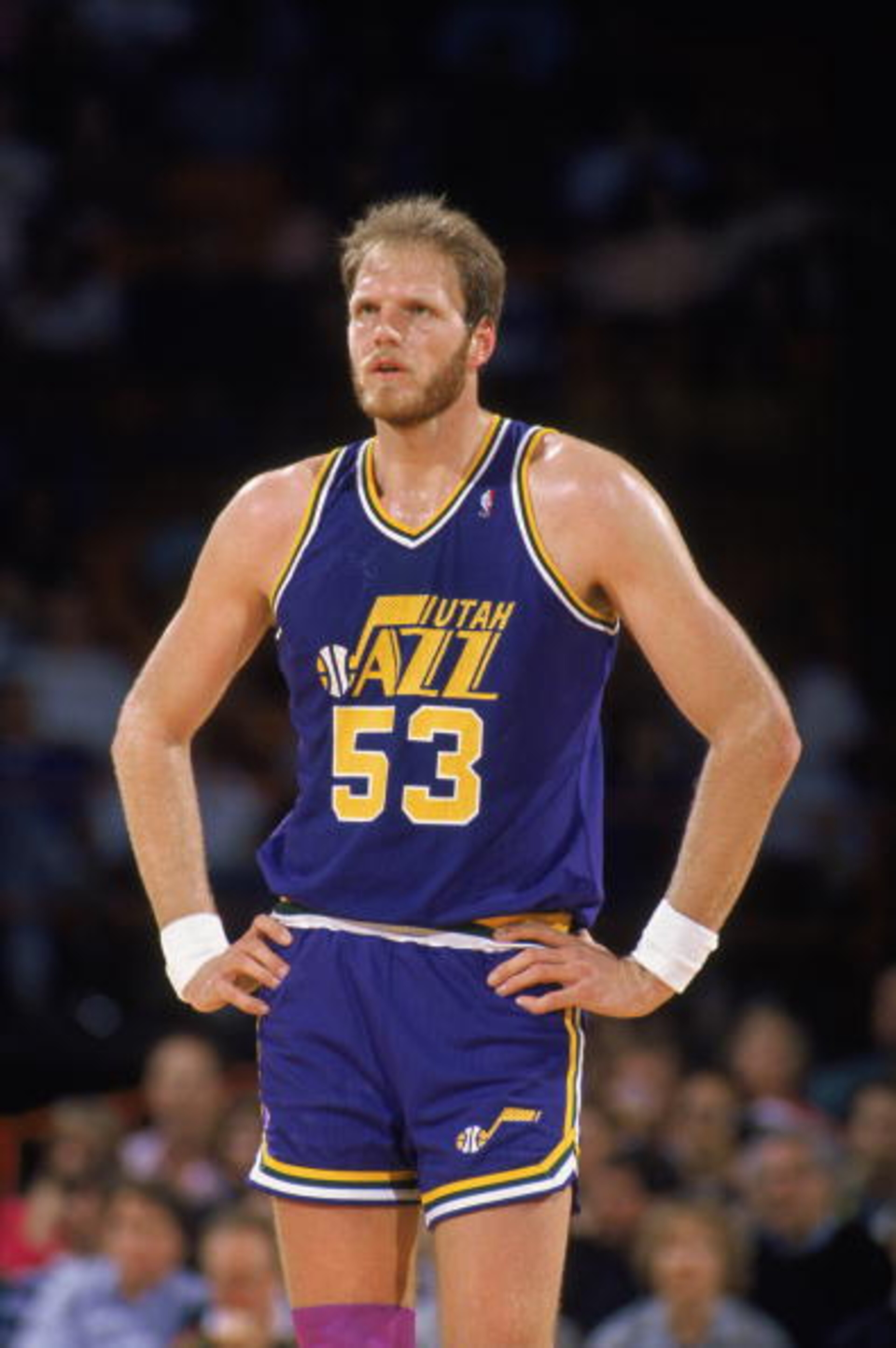 DENVER - 1989:  Mark Eaton #53 of the Utah Jazz stands on the court during an NBA game against the Denver Nuggets at McNichols Sports Arena in Denver, Colorado in 1989. (Photo by Tim DeFrisco/Getty Images)