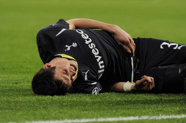 MADRID, SPAIN - APRIL 05:  Gareth Bale of Tottenham Hotspur reacts after being injured during the UEFA Champions League quarter final first leg match between Real Madrid and Tottenham Hotspur at Estadio Santiago Bernabeu on April 5, 2011 in Madrid, Spain.