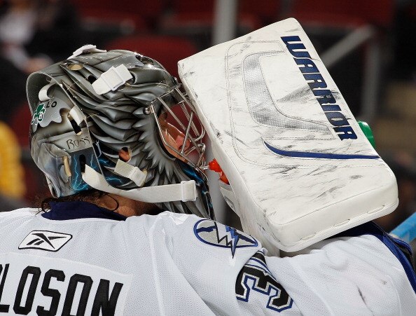 NEWARK, NJ - MARCH 02:  Goalie Dwayne Roloson #35 of the Tampa Bay Lightning takes a drink during a timeout in an NHL hockey game against the New Jersey Devils at the Prudential Center on March 2, 2011 in Newark, New Jersey.  (Photo by Paul Bereswill/Gett