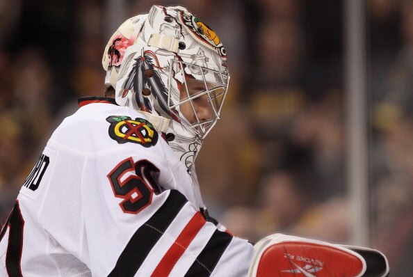BOSTON, MA - MARCH 29:  Corey Crawford #50 of the Chicago Blackhawks takes a break during a stop in play against the Boston Bruins on March 29, 2011 at the TD Garden in Boston, Massachusetts. The Boston Bruins defeated the Chicago Blackhawks 3-0.  (Photo