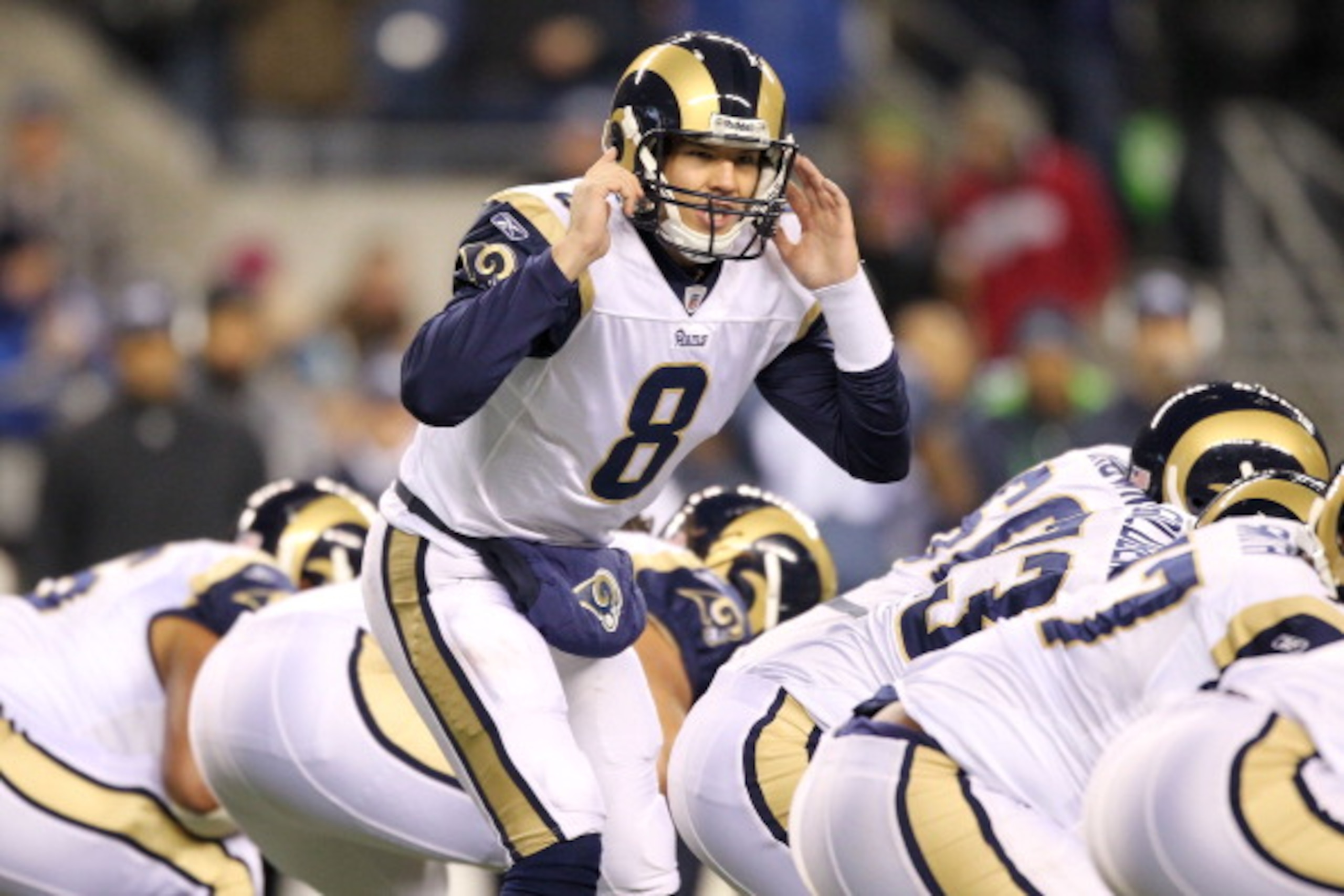 SEATTLE, WA - JANUARY 02:  Quarterback Sam Bradford #8 of the St. Louis Rams signals to his teammates during their game against the Seattle Seahawks at Qwest Field on January 2, 2011 in Seattle, Washington.  (Photo by Otto Greule Jr/Getty Images)