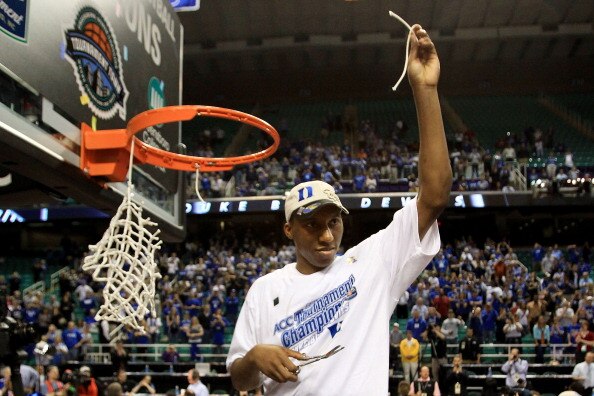 GREENSBORO, NC - MARCH 13:  Nolan Smith #2 of the Duke Blue Devils cuts down the net after defeating the North Carolina Tar Heels 75-58 in the championship game of the 2011 ACC men's basketball tournament at the Greensboro Coliseum on March 13, 2011 in Gr