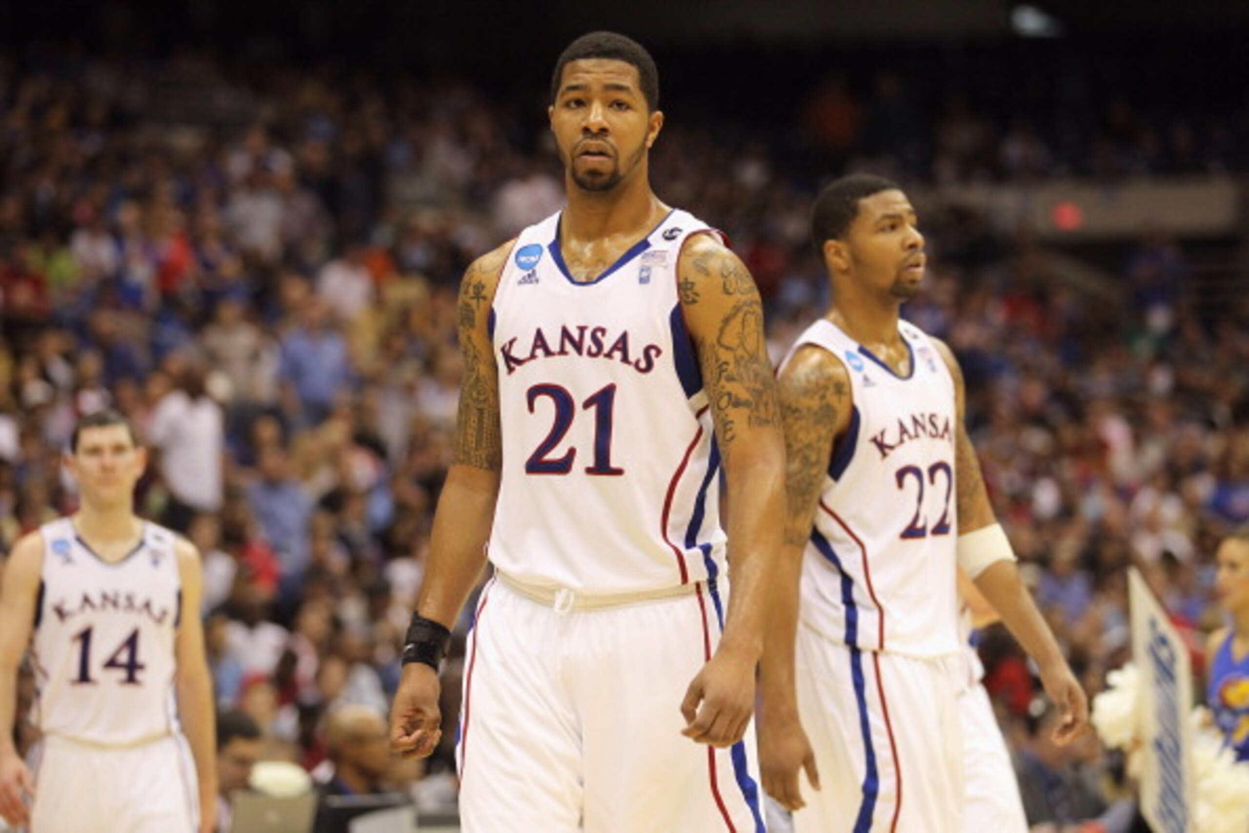 SAN ANTONIO, TX - MARCH 27:  Markieff Morris #21 and Marcus Morris #22 of the Kansas Jayhawks react during the southwest regional final of the 2011 NCAA men's basketball tournament against the Virginia Commonwealth Rams at the Alamodome on March 27, 2011 