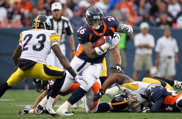 DENVER - AUGUST 29:  Running back LenDale White #26 of the Denver Broncos rushes the ball and attempts to elude cornerback Keenan Lewis #23 of the Pittsburgh Steelers during preseason NFL action at INVESCO Field at Mile High on August 29, 2010 in Denver, 