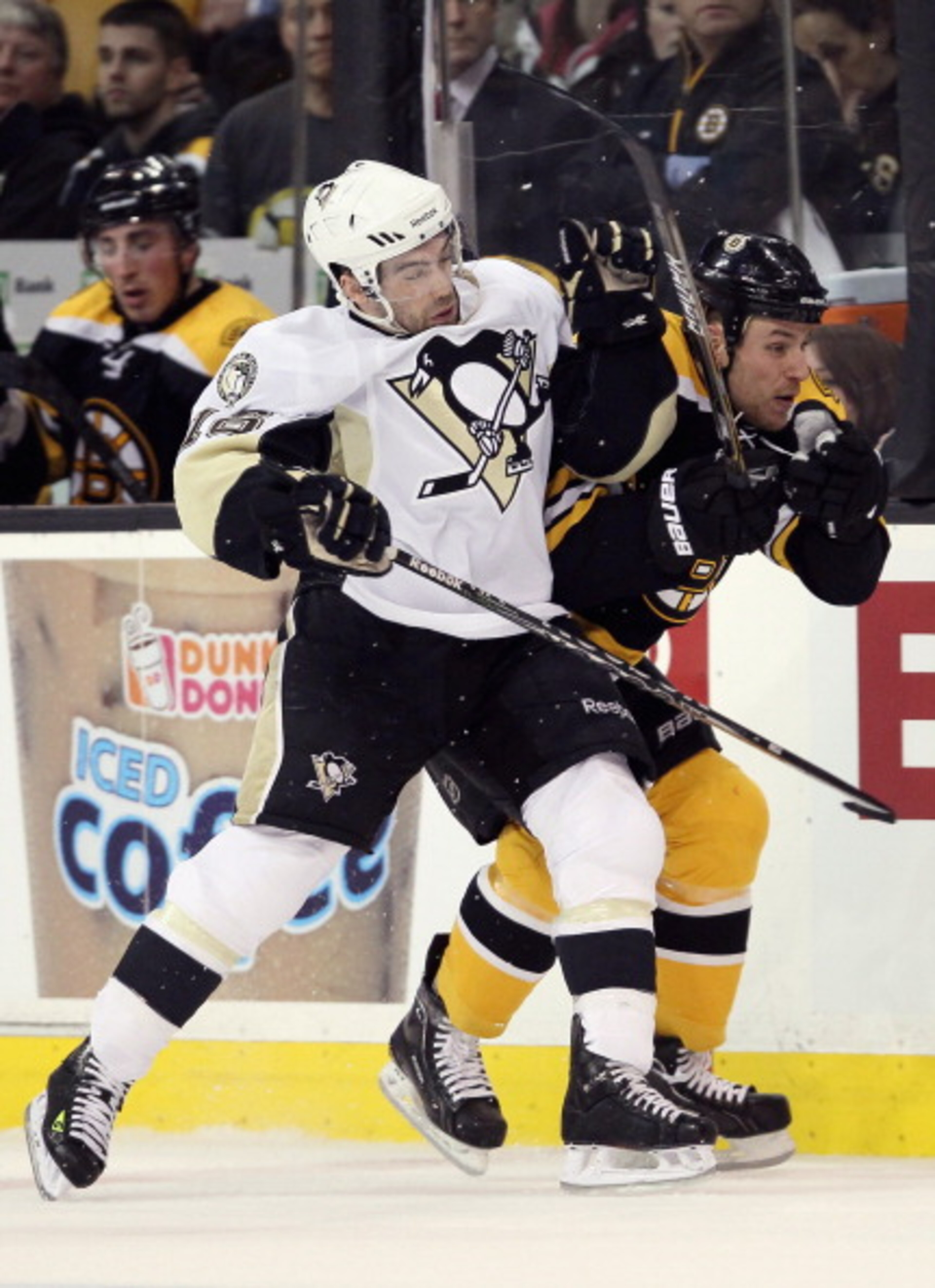 BOSTON, MA - MARCH 05:  Chris Conner #16 of the Pittsburgh Penguins and Gregory Campbell #11 of the Boston Bruins collide in the second periodon March 5, 2011 at the TD Garden in Boston, Massachusetts.  (Photo by Elsa/Getty Images)