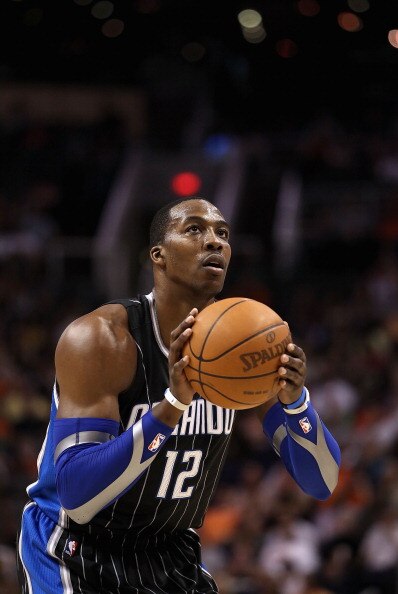 PHOENIX, AZ - MARCH 13:  Dwight Howard #12 of the Orlando Magic shoots a free throw shot during the NBA game against the Phoenix Suns at US Airways Center on March 13, 2011 in Phoenix, Arizona. The Magic defeated the Suns 111-88. NOTE TO USER: User expres