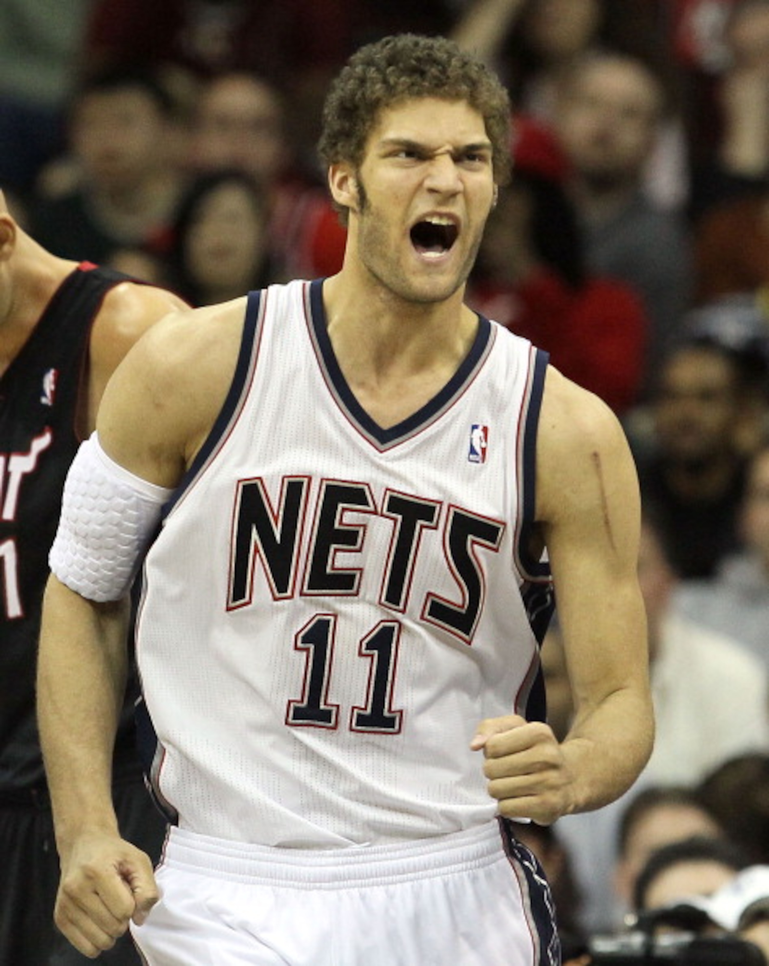 NEWARK, NJ - APRIL 03:  Brook Lopez #11 of the New Jersey Nets reacts against the Miami Heat at the Prudential Center on April 3, 2011 in Newark, New Jersey.The Heat defeated the Nets 108-94.NOTE TO USER: User expressly acknowledges and agrees that, by do