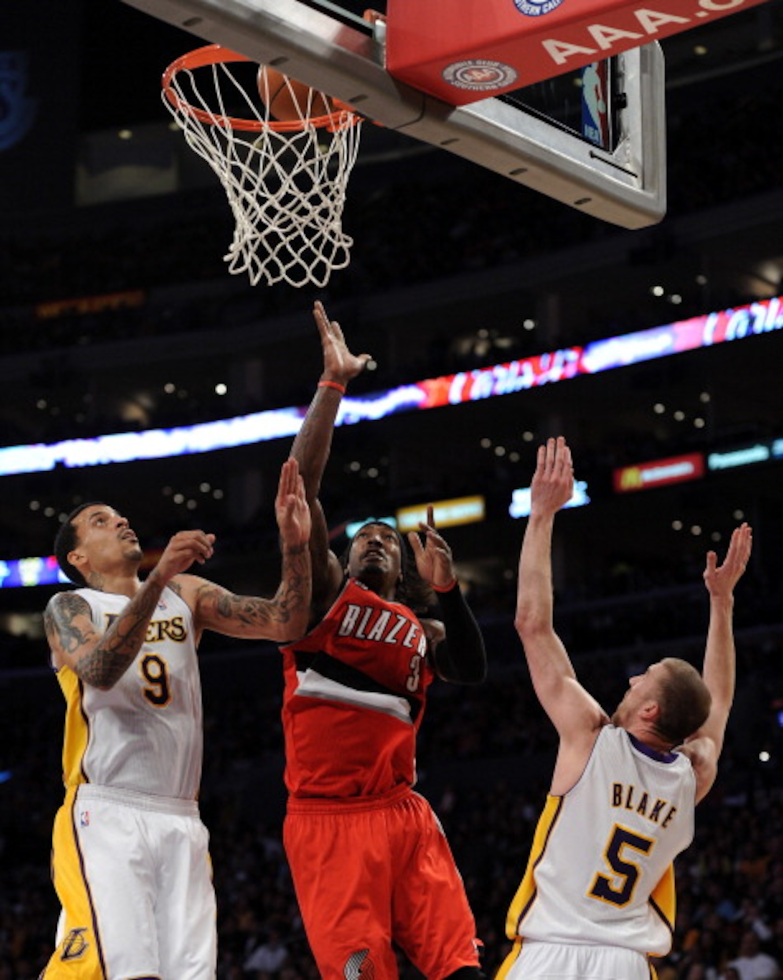 LOS ANGELES, CA - MARCH 20: Gerald Wallace #3 of the Portland Trail Blazers scores off of a layup in front of Matt Barnes #9 and Steve Blake #5 of the Los Angeles Lakers at the Staples Center on March 20, 2011 in Los Angeles, California. NOTE TO USER: U LOS ANGELES, CA - MARCH 20: Gerald Wallace #3 of the Portland Trail Blazers scores off of a layup in front of Matt Barnes #9 and Steve Blake #5 of the Los Angeles Lakers at the Staples Center on March 20, 2011 in Los Angeles, California. NOTE TO USER: U