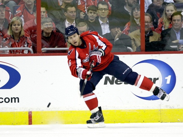 WASHINGTON, DC - MARCH 29:  Dennis Wideman #6 of the Washington Capitals passes the puck against the Carolina Hurricanes at the Verizon Center on March 29, 2011 in Washington, DC.  (Photo by Rob Carr/Getty Images)