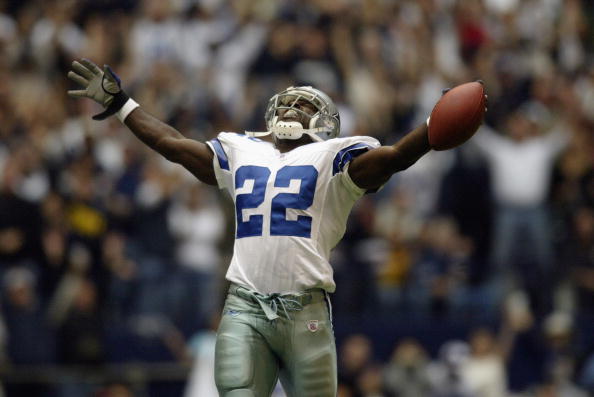 IRVING, TX - OCTOBER 27:  Running back Emmitt Smith celebrates after breaking the all time NFL rushing record against the Seattle Seahawks at Texas Stadium on October 27, 2002 in Irving, Texas. The Seahawks defeated the Cowboys 17-14. (Photo by Ronald Mar